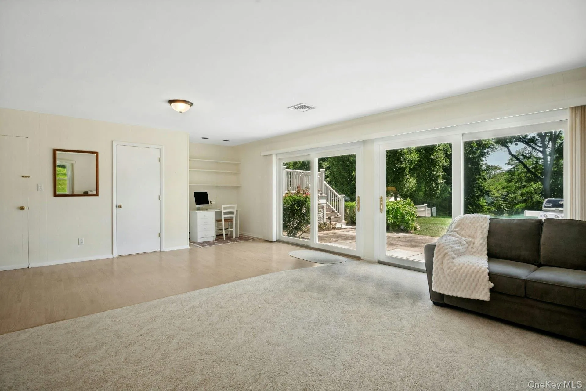 Detail view of family room with door to half bath visible. Detail view of family room with door to half bath visible.