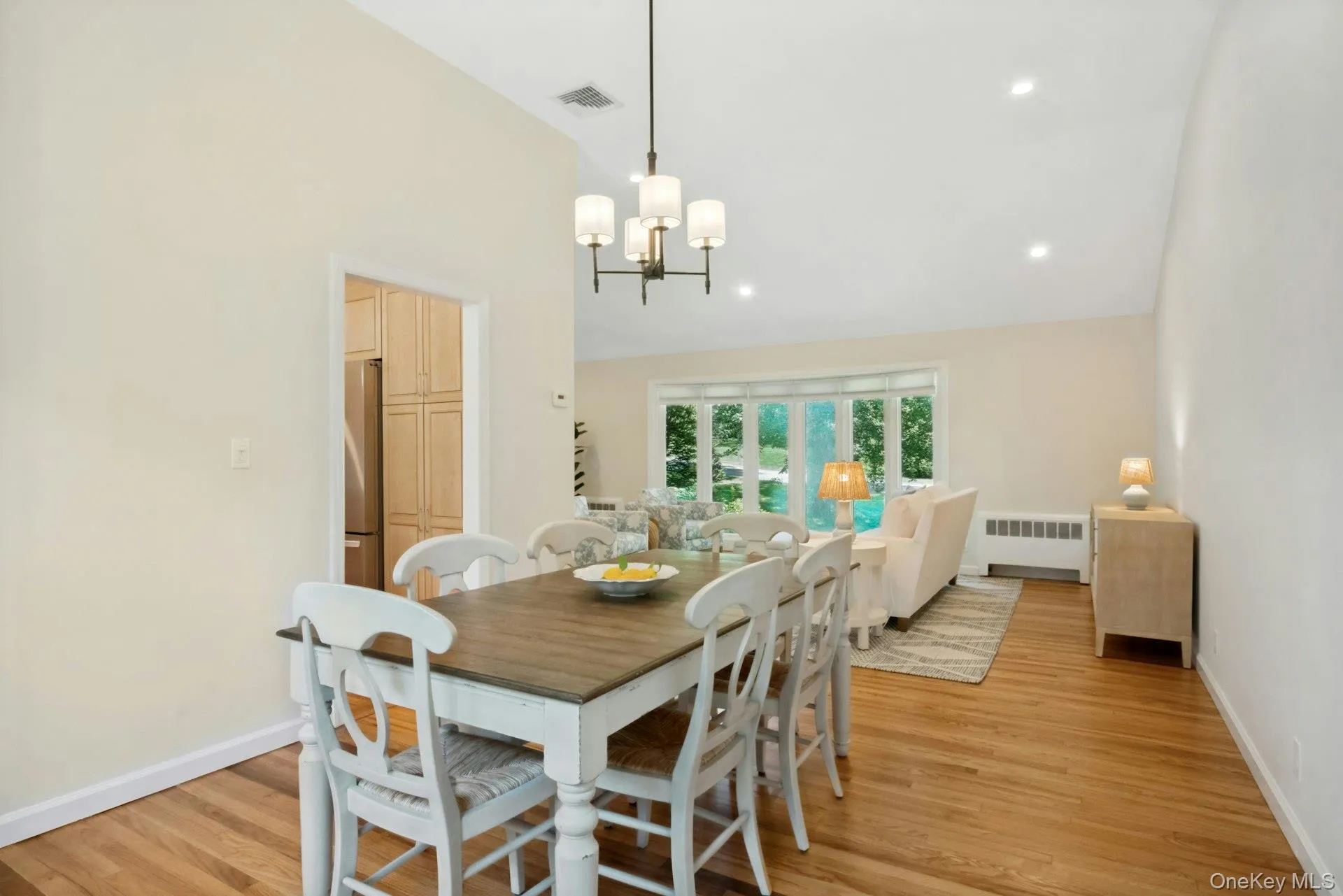 Dining room with entry to kitchen visible on left. Dining room with entry to kitchen visible on left.