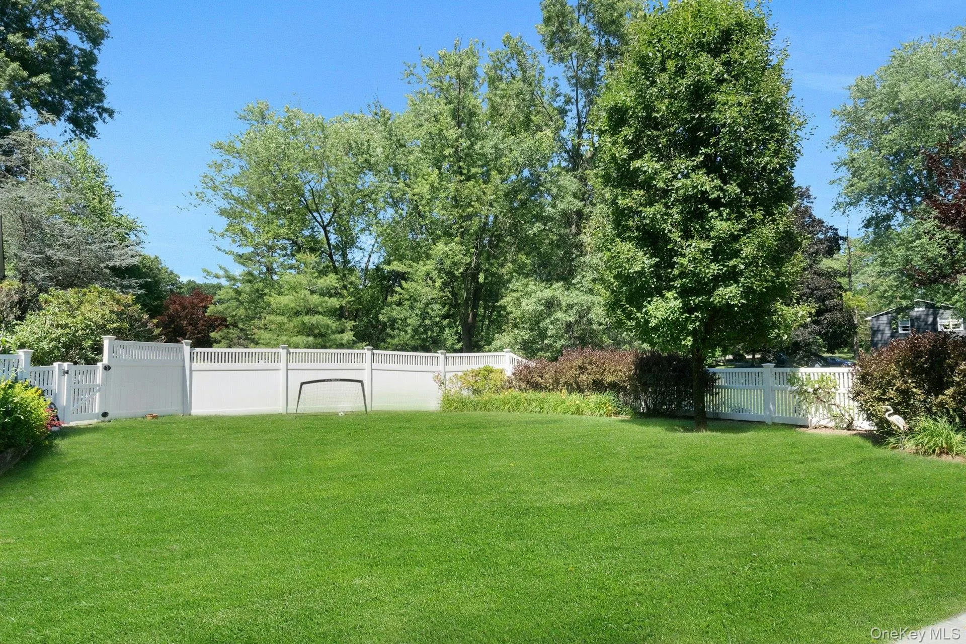 Opposite end of the fenced play yard area. Opposite end of the fenced play yard area.