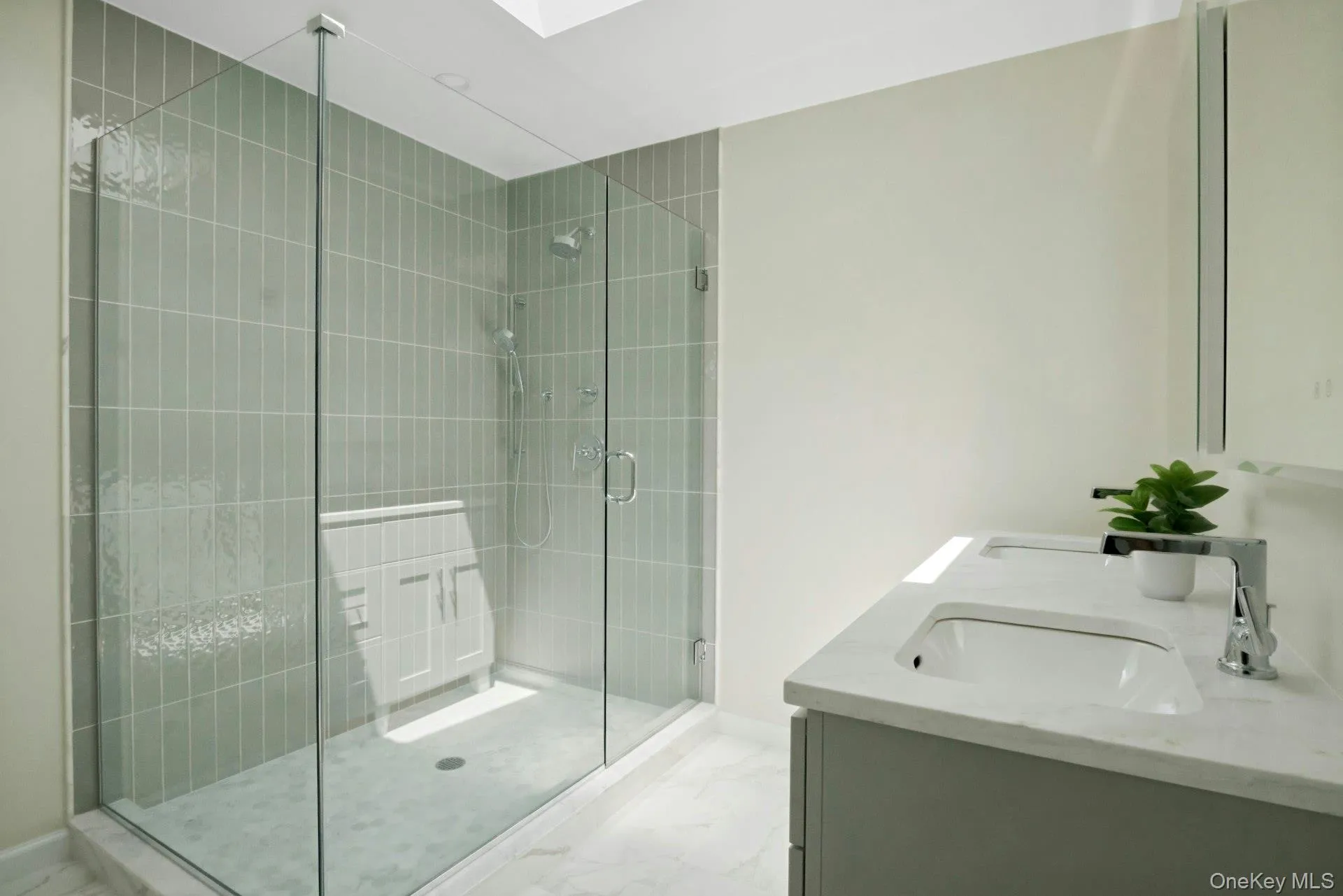 Brand new ensuite primary bathroom with shower and dual sink vanity. Brand new ensuite primary bathroom with shower and dual sink vanity.
