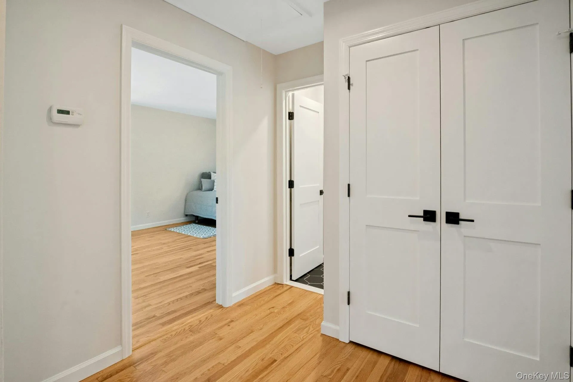 Upper level landing. Linen closet has motion activated light inside. Upper level landing. Linen closet has motion activated light inside.