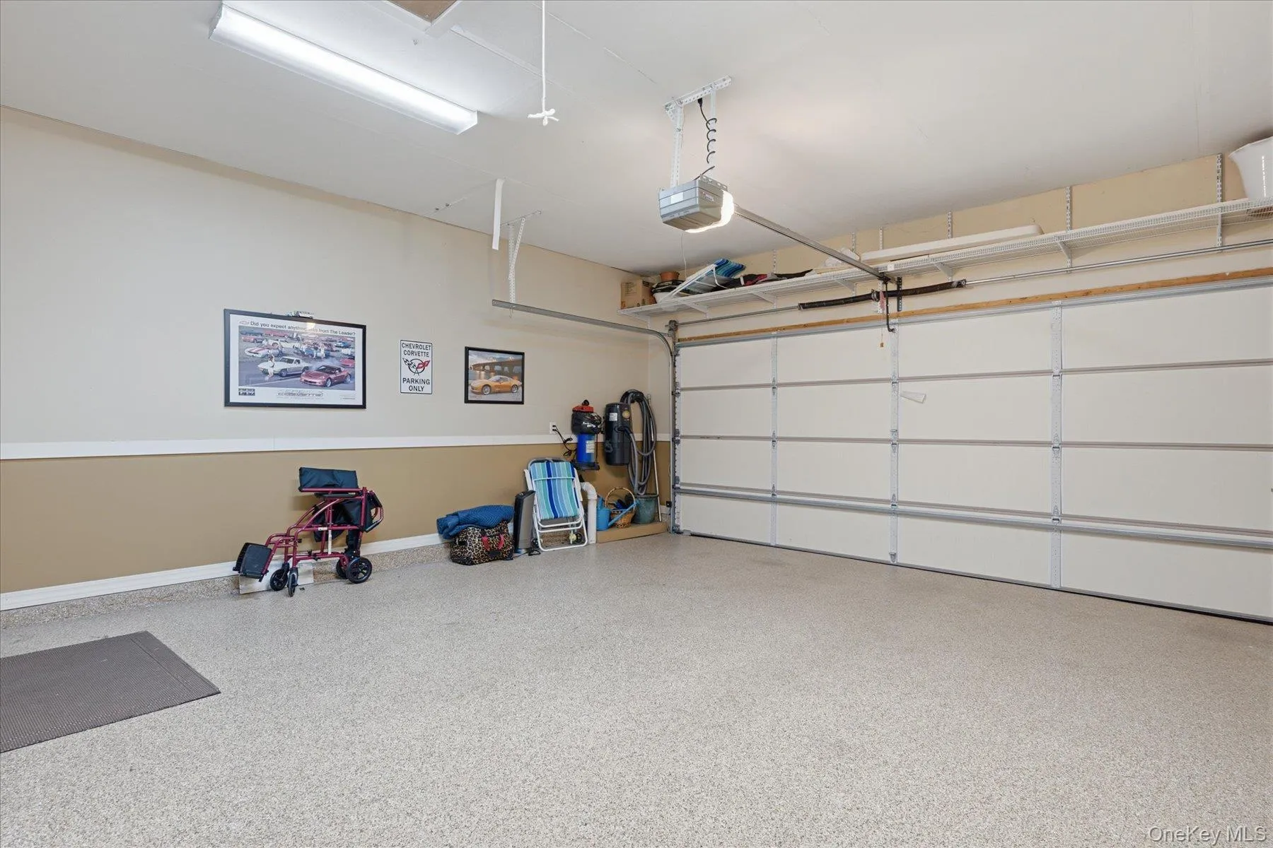 2 car garage with Epoxy floors and built in cabinetry 2 car garage with Epoxy floors and built in cabinetry