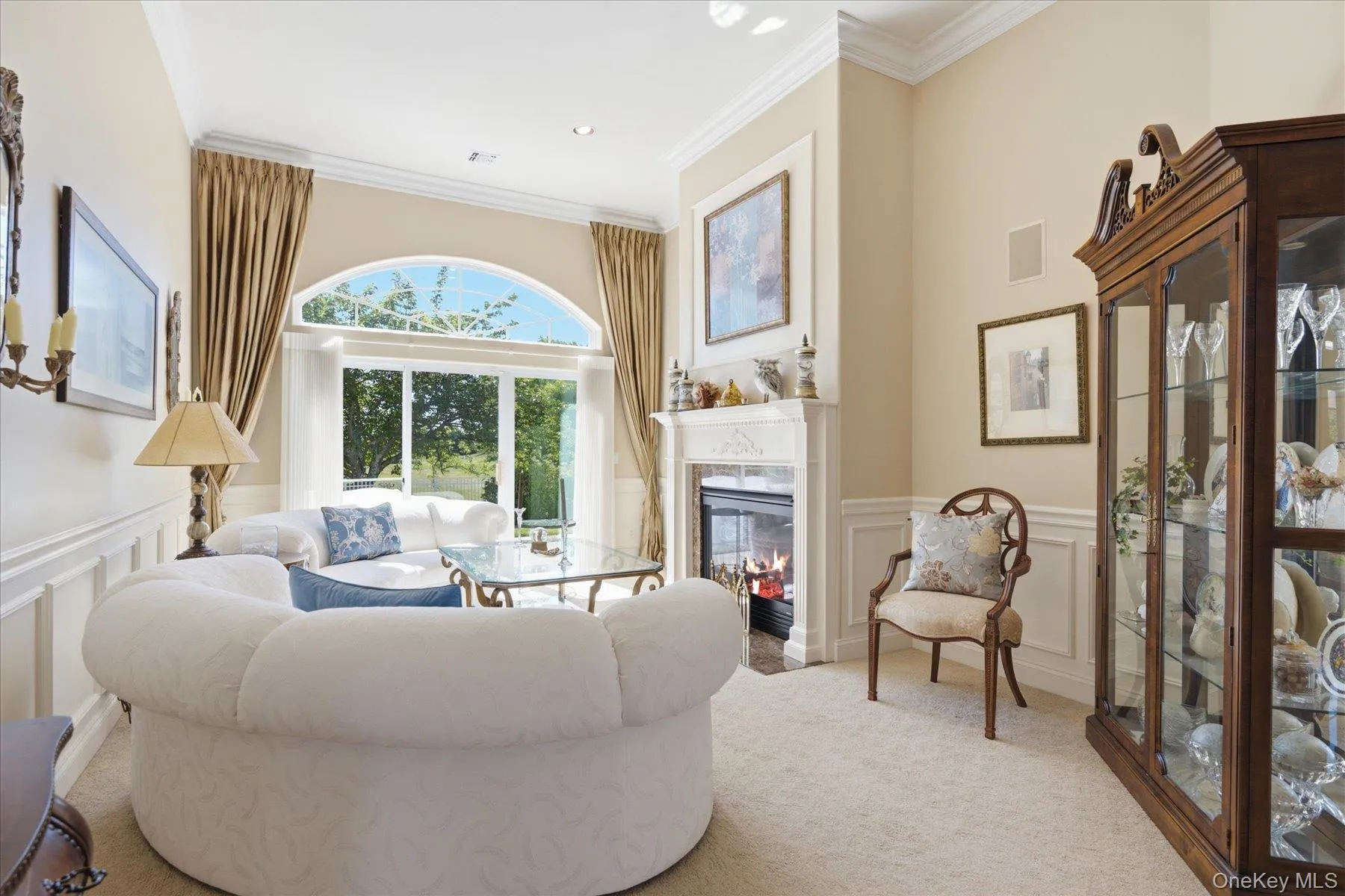 Formal Living Room with View of Golf Course and gas fireplace Formal Living Room with View of Golf Course and gas fireplace