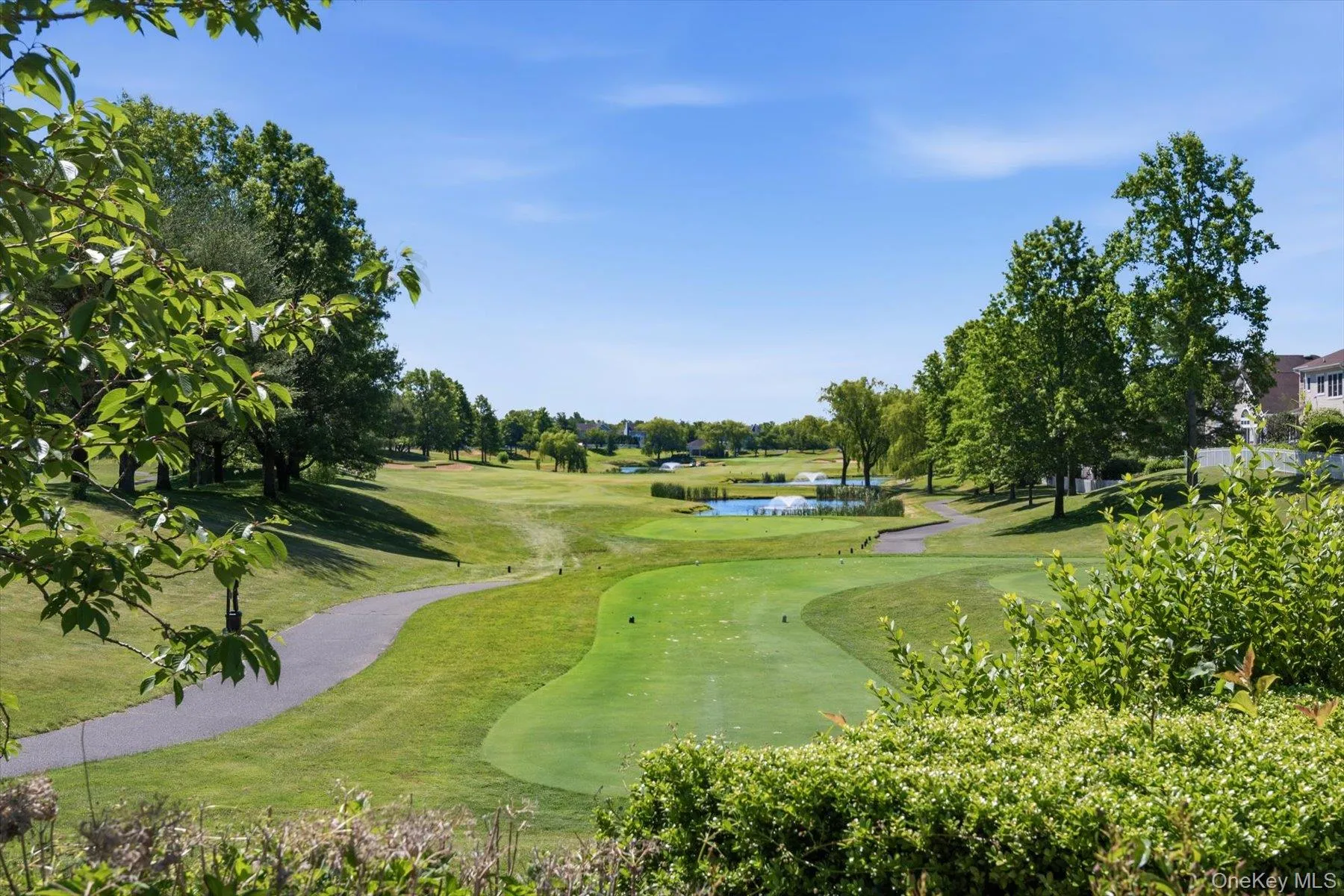 Beautiful view of golf course and pond Beautiful view of golf course and pond