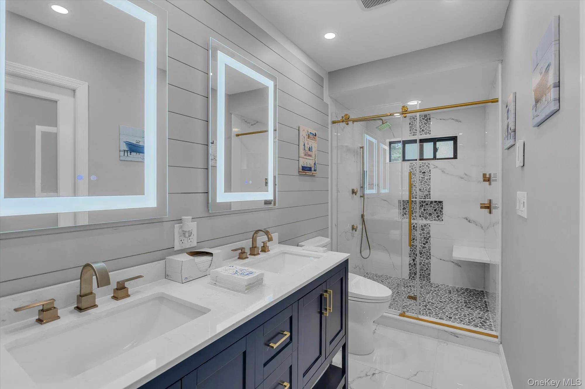 Beautifully renovated with double vanity, LED light up mirrors and large shower with tile surround and glass sliding door. Beautifully renovated with double vanity, LED light up mirrors and large shower with tile surround and glass sliding door.