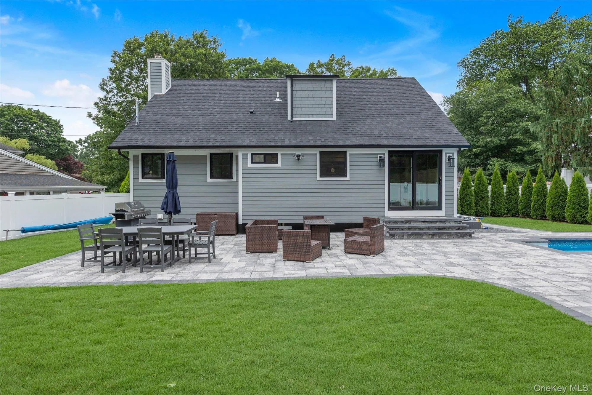 Paved patio with plenty of space for dining and seating area. Paved patio with plenty of space for dining and seating area.