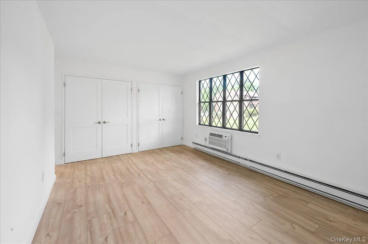 Primary bedroom with double closets. Primary bedroom with double closets.