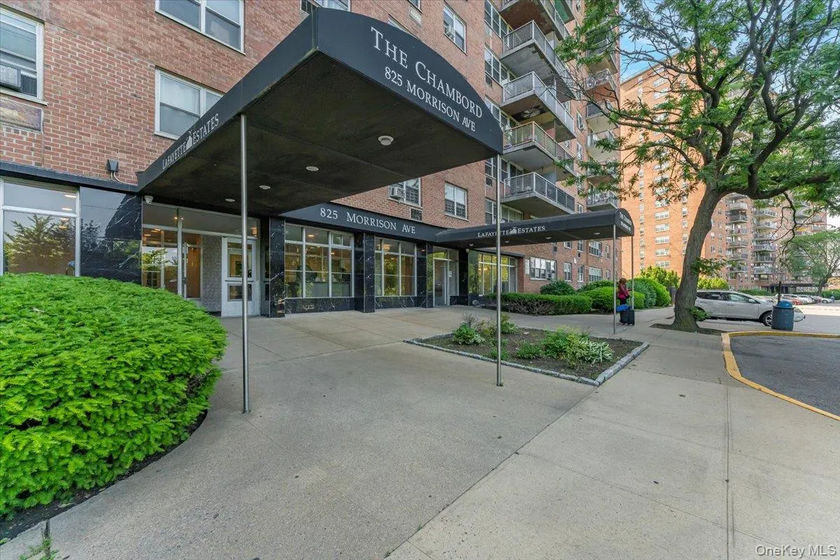 View of apartment building / complex featuring parking View of apartment building / complex featuring parking