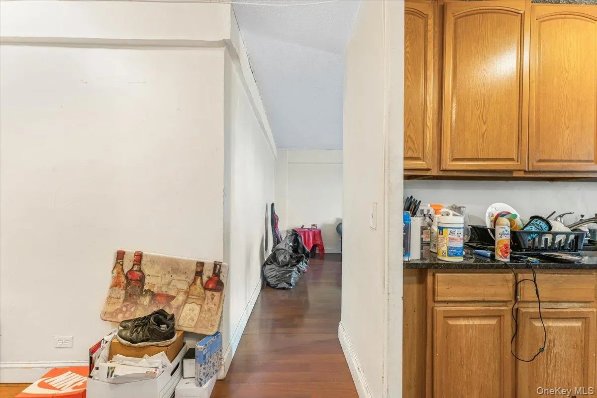 Bar area featuring wood finished floors and baseboards Bar area featuring wood finished floors and baseboards