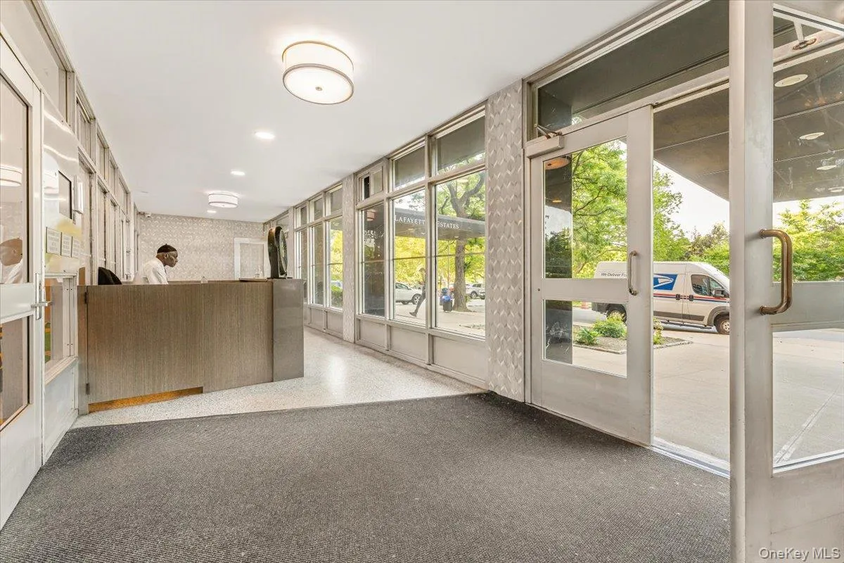 Reception area with wallpapered walls and recessed lighting Reception area with wallpapered walls and recessed lighting