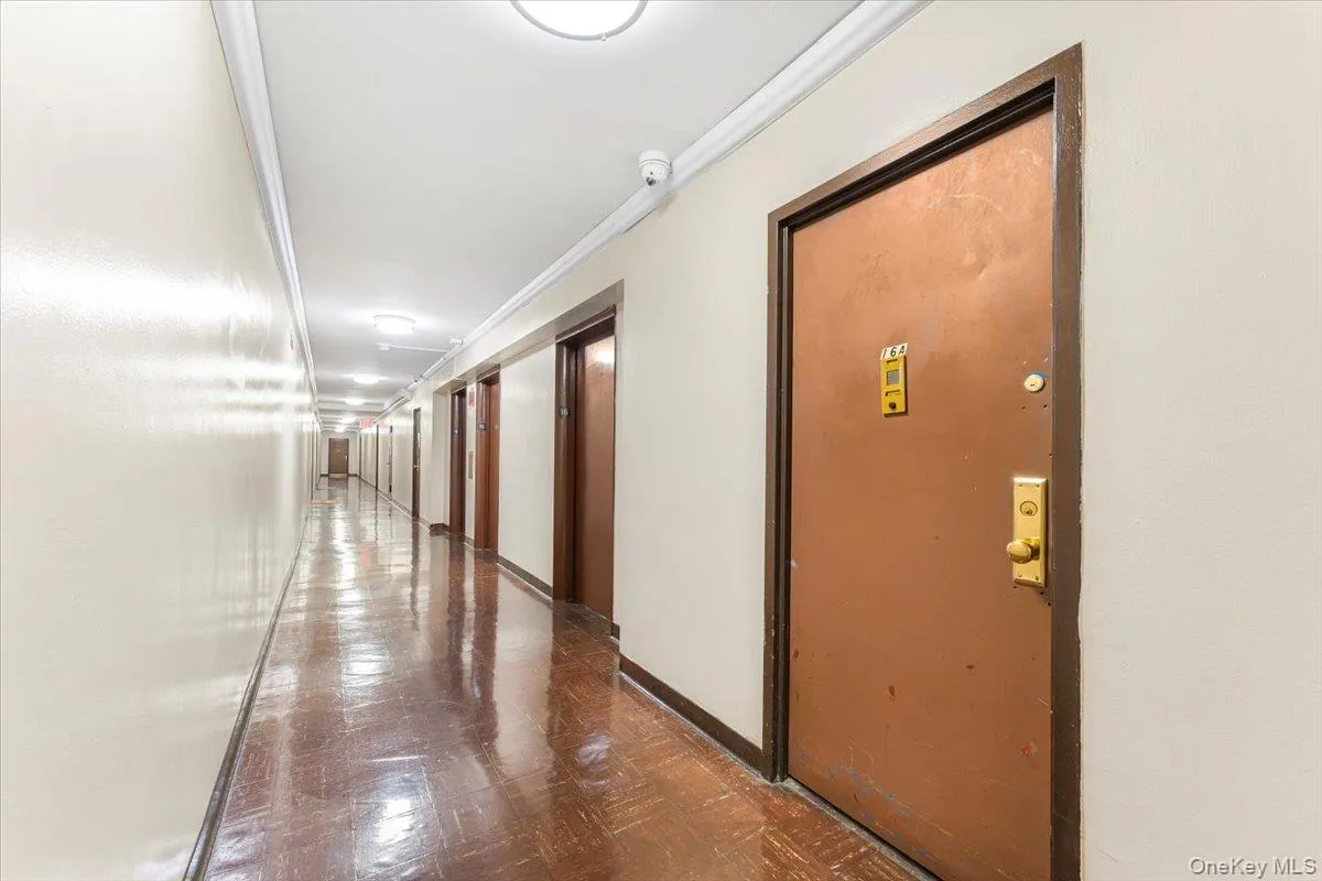 Hall featuring ornamental molding and baseboards Hall featuring ornamental molding and baseboards