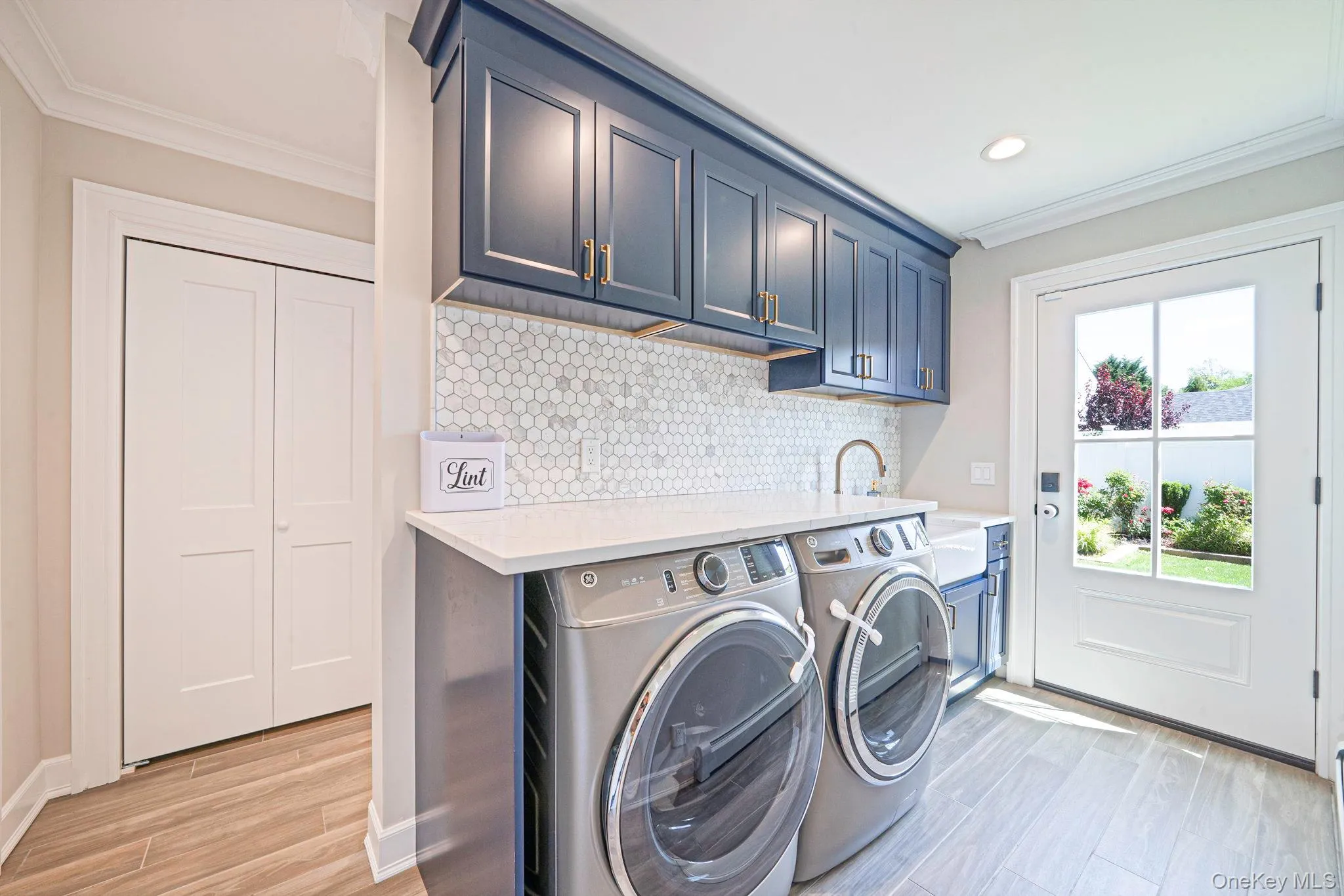 Updated Laundry Area with Quartz Countertops, Sink, Ample Storage (Added with Extension 2022) Updated Laundry Area with Quartz Countertops, Sink, Ample Storage (Added with Extension 2022)