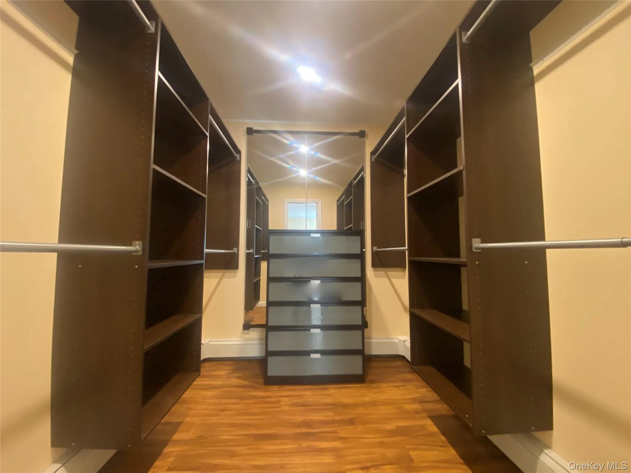 Primary Bedroom, Walk-in closet Primary Bedroom, Walk-in closet