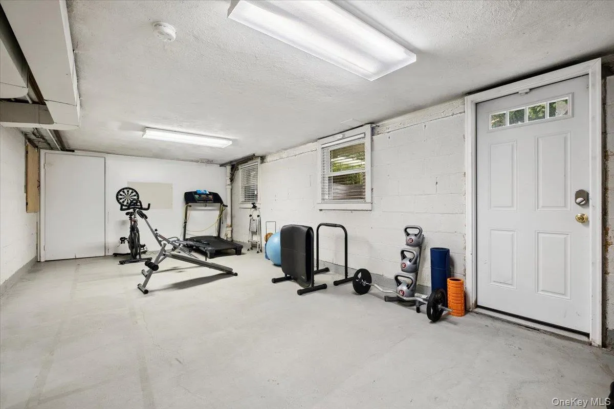 Unfinished basement with door to backyard. Unfinished basement with door to backyard.