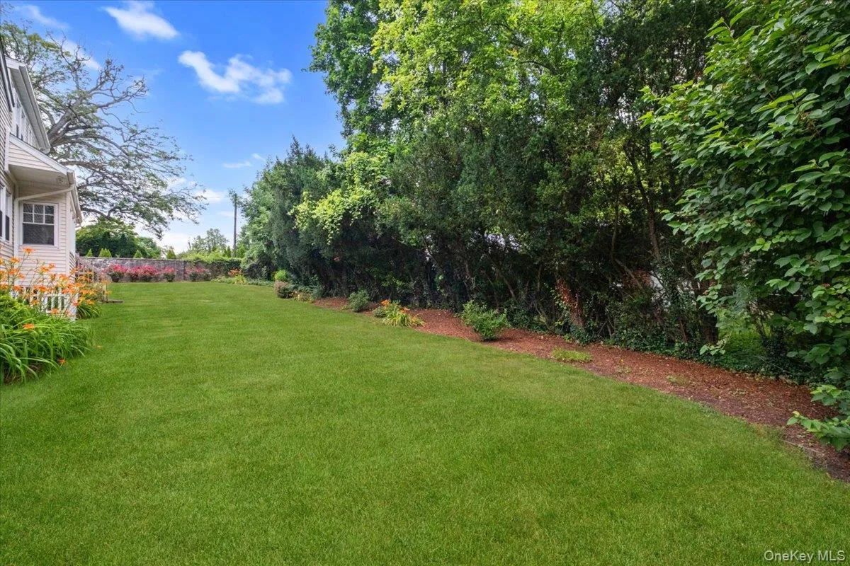 Pretty backyard with mature trees and plenty of lawn to have fun with friends and family. Pretty backyard with mature trees and plenty of lawn to have fun with friends and family.