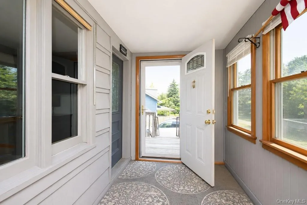 Enclosed front porch - virtually staged Enclosed front porch - virtually staged
