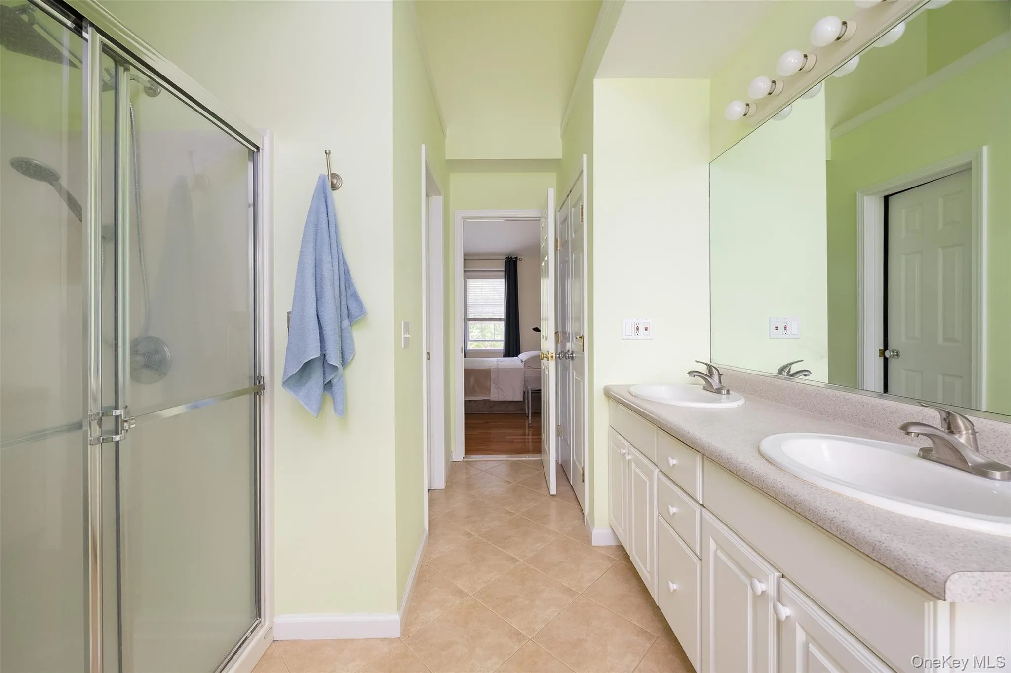 Primary ensuite bathroom. Walk-in closet and linen closet both in bathroom. Primary ensuite bathroom. Walk-in closet and linen closet both in bathroom.