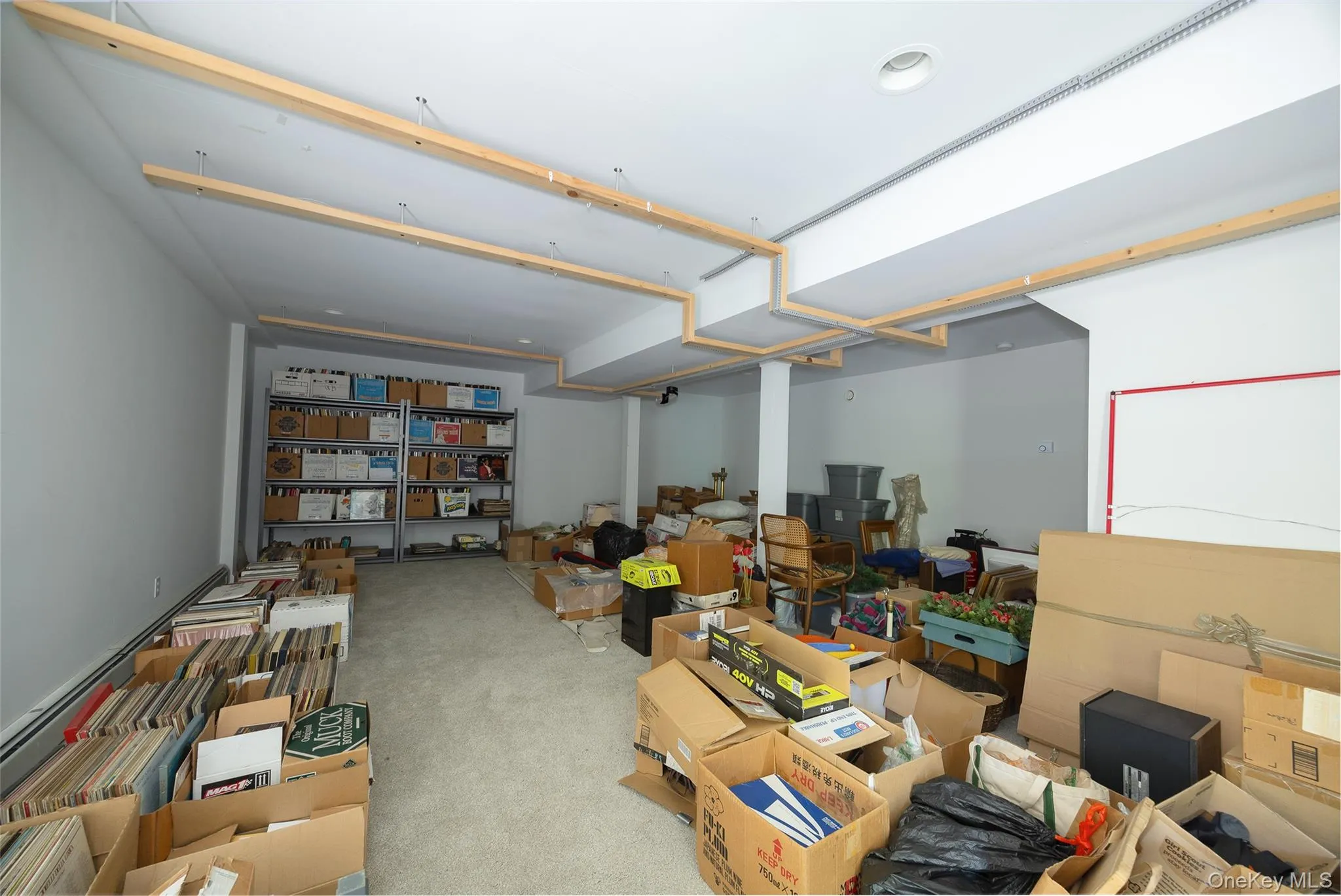 The basement is on two sides. One has utilities and the other is carpeted and can be used for varied needs. The basement is on two sides. One has utilities and the other is carpeted and can be used for varied needs.