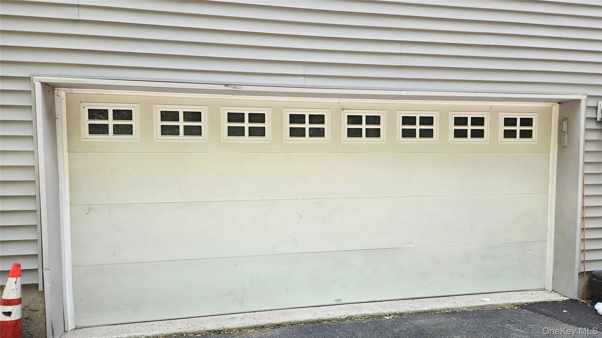 Two car garage behind building. Two car garage behind building.