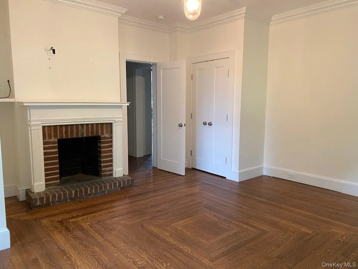 Brick fireplace with a white mantel and hearth Brick fireplace with a white mantel and hearth