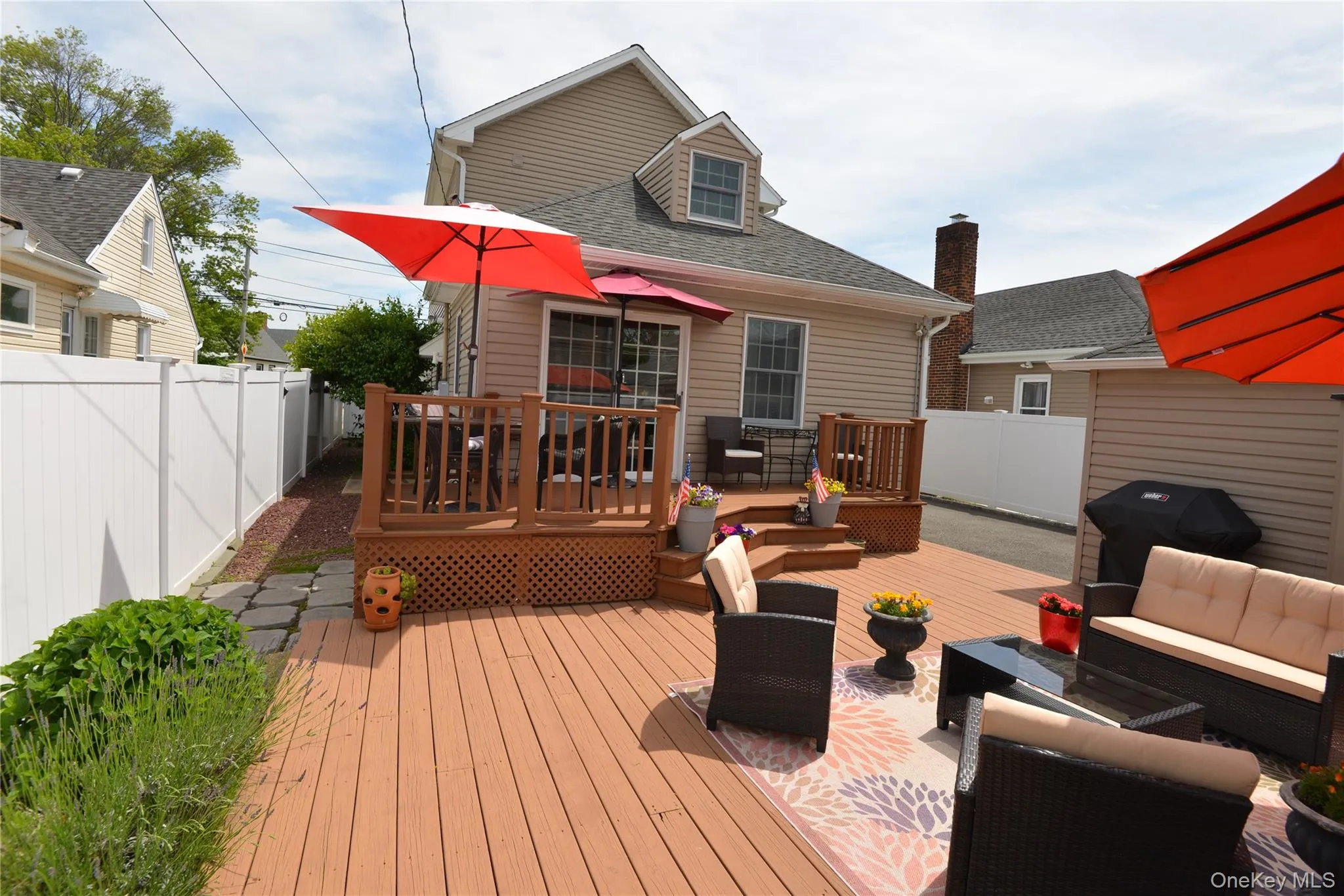 Expansive multi-level wood deck with lattice detailing and privacy fencing Expansive multi-level wood deck with lattice detailing and privacy fencing