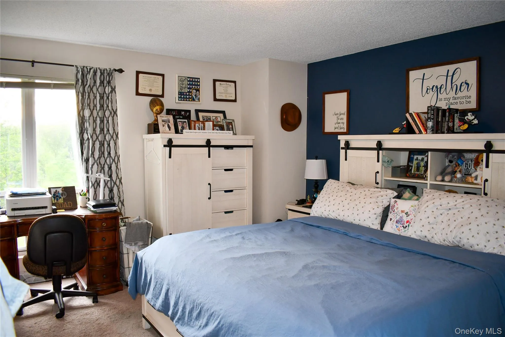 Room with a prominent accent wall in a deep blue hue Room with a prominent accent wall in a deep blue hue
