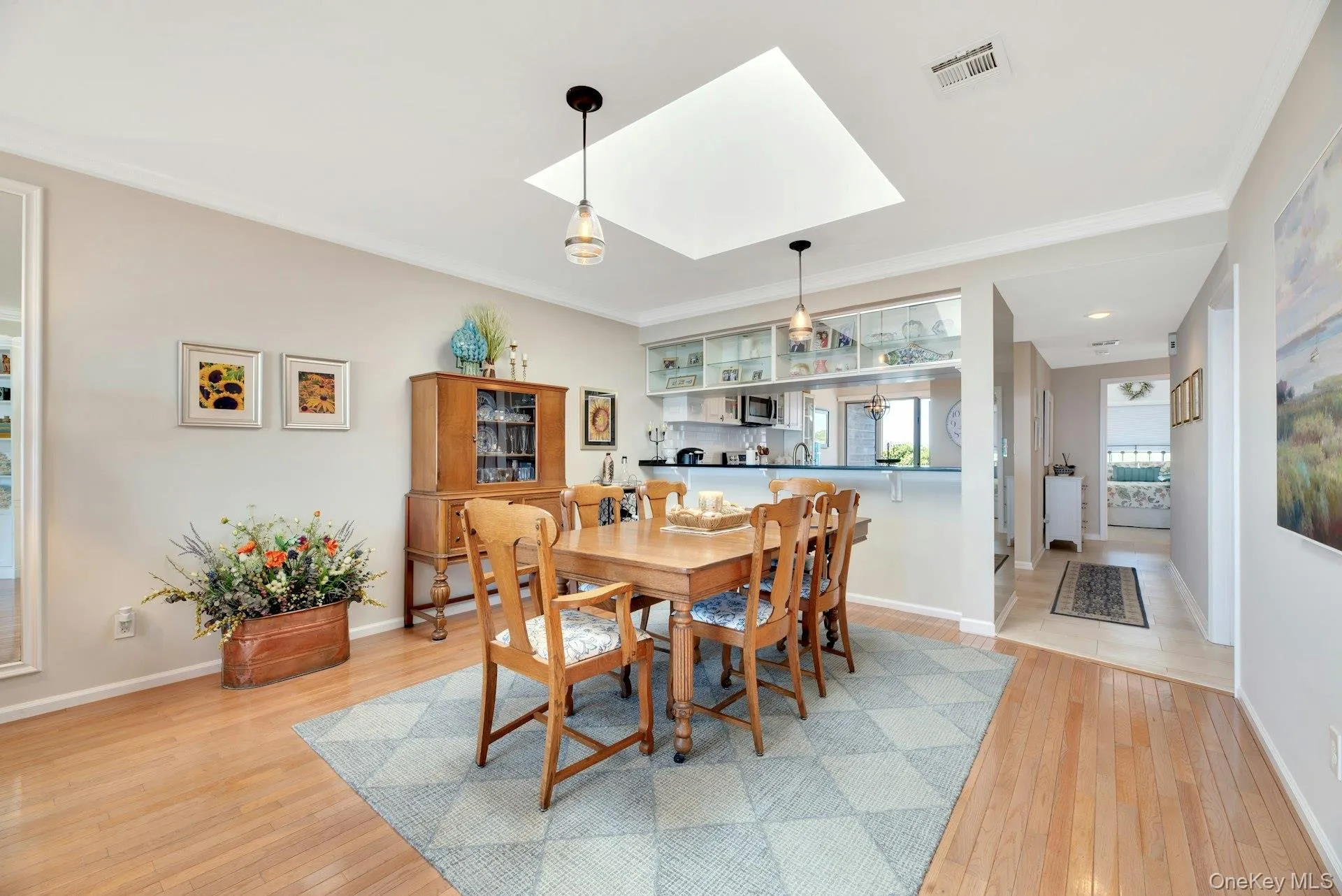Dining room with skylight and wood floors. Dining room with skylight and wood floors.