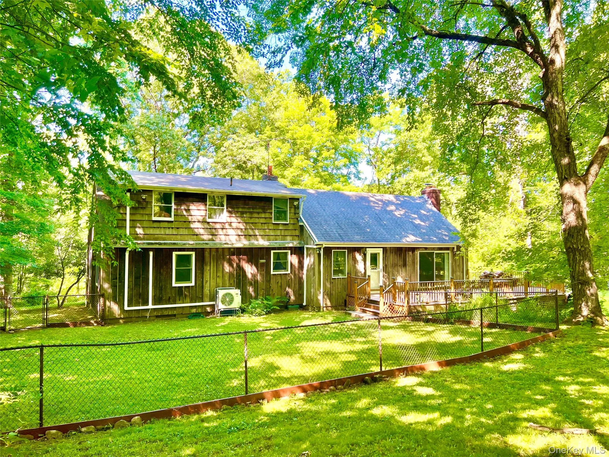 Showing fenced in area, deck, heat pump. Showing fenced in area, deck, heat pump.