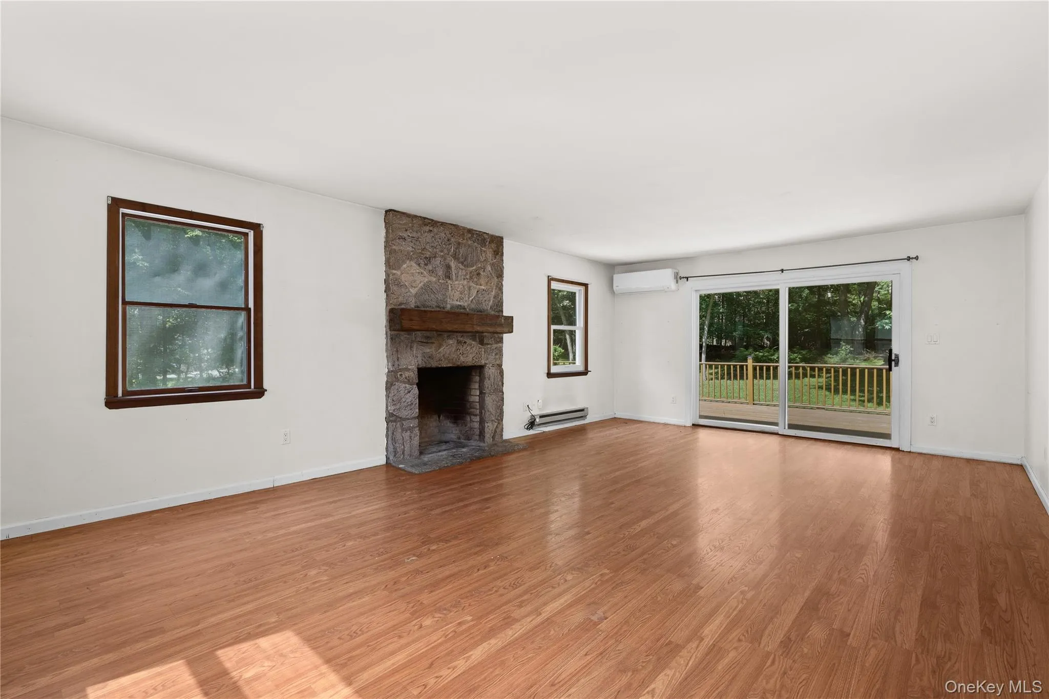 The family room has sliders to the deck and fireplace. The family room has sliders to the deck and fireplace.