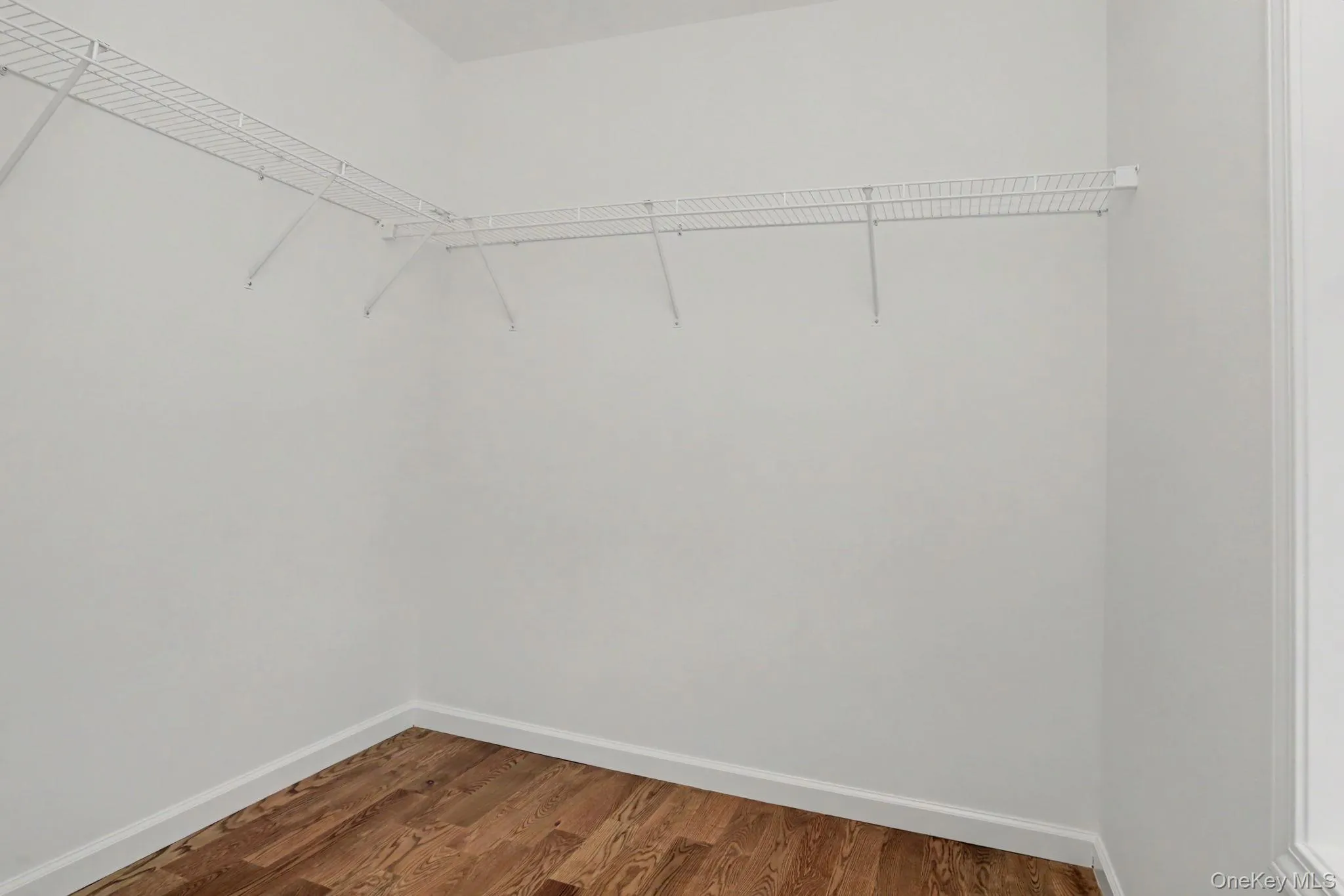 Walk-in primary closet Walk-in primary closet