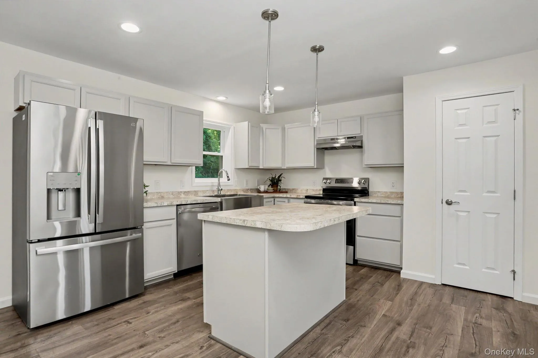 Kitchen with stainless steel appliances and pantry closet Kitchen with stainless steel appliances and pantry closet