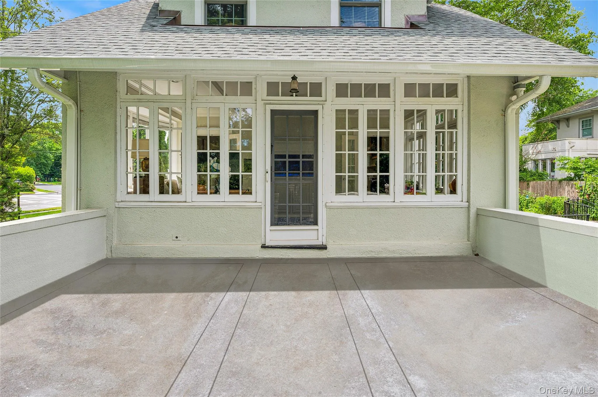 View of the enclosed patio off the sunroom. View of the enclosed patio off the sunroom.