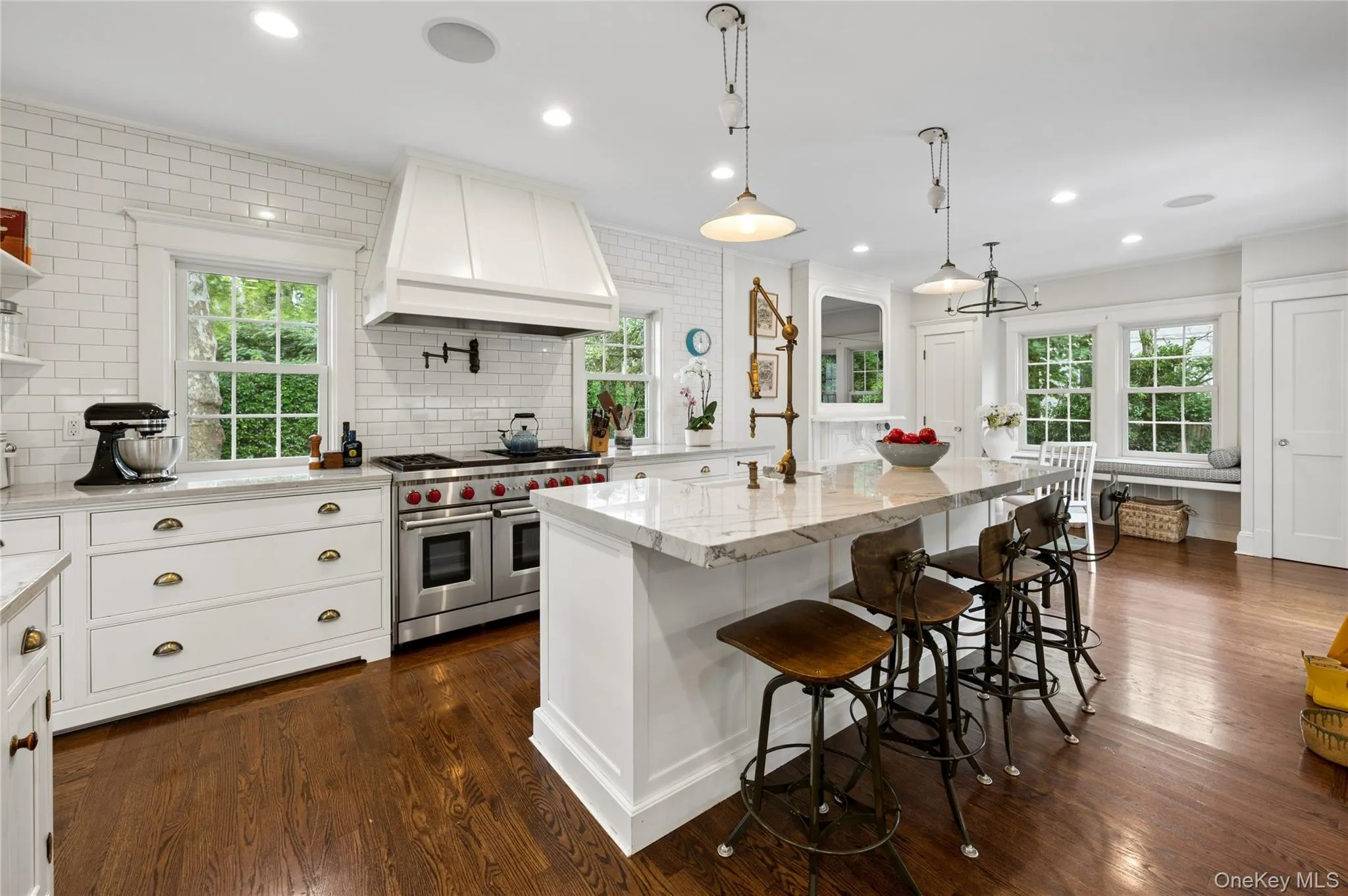 This center island seats plenty and features 2" quartzite counters. This center island seats plenty and features 2" quartzite counters.