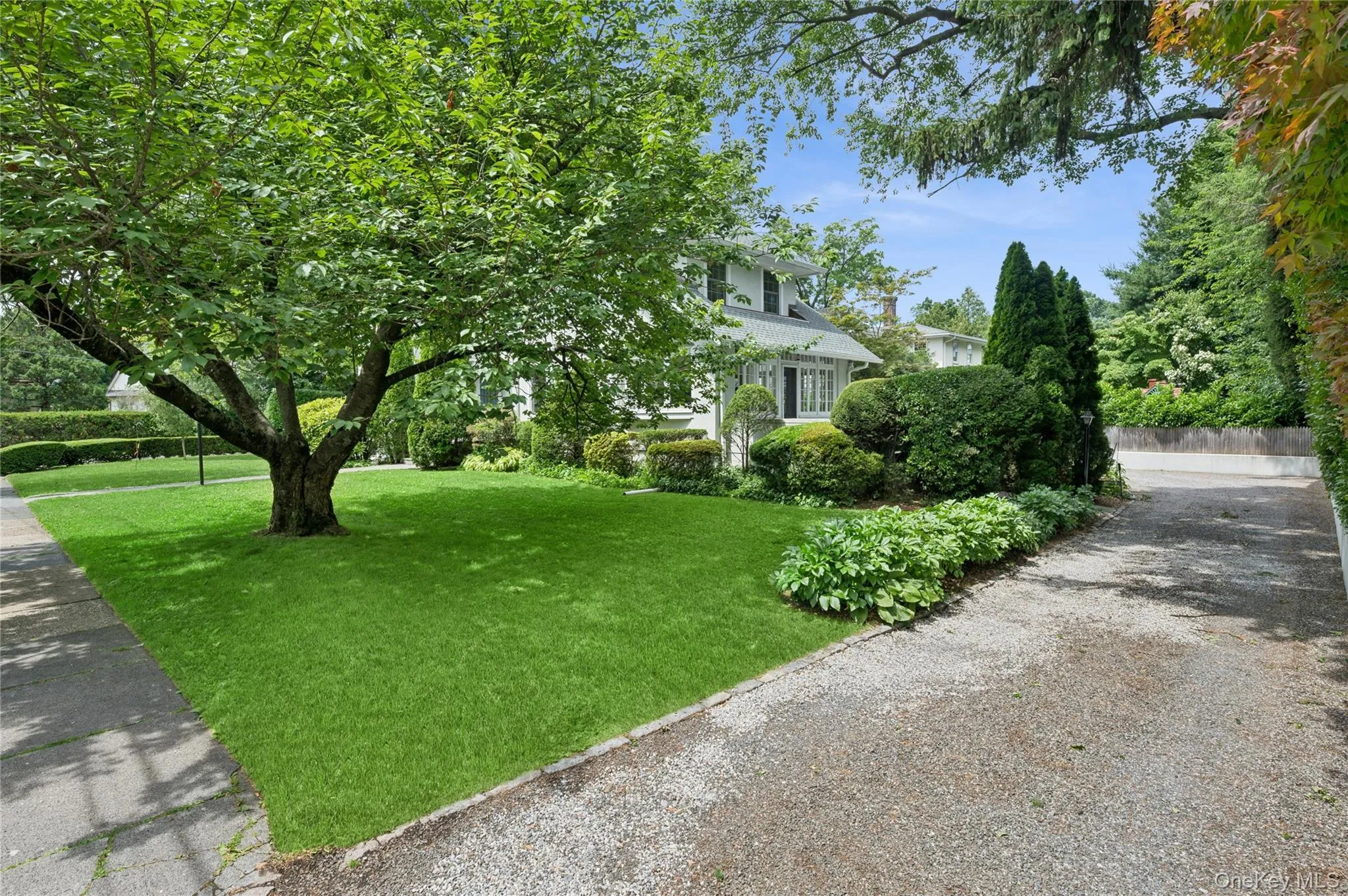 View of the long gravel driveway. View of the long gravel driveway.