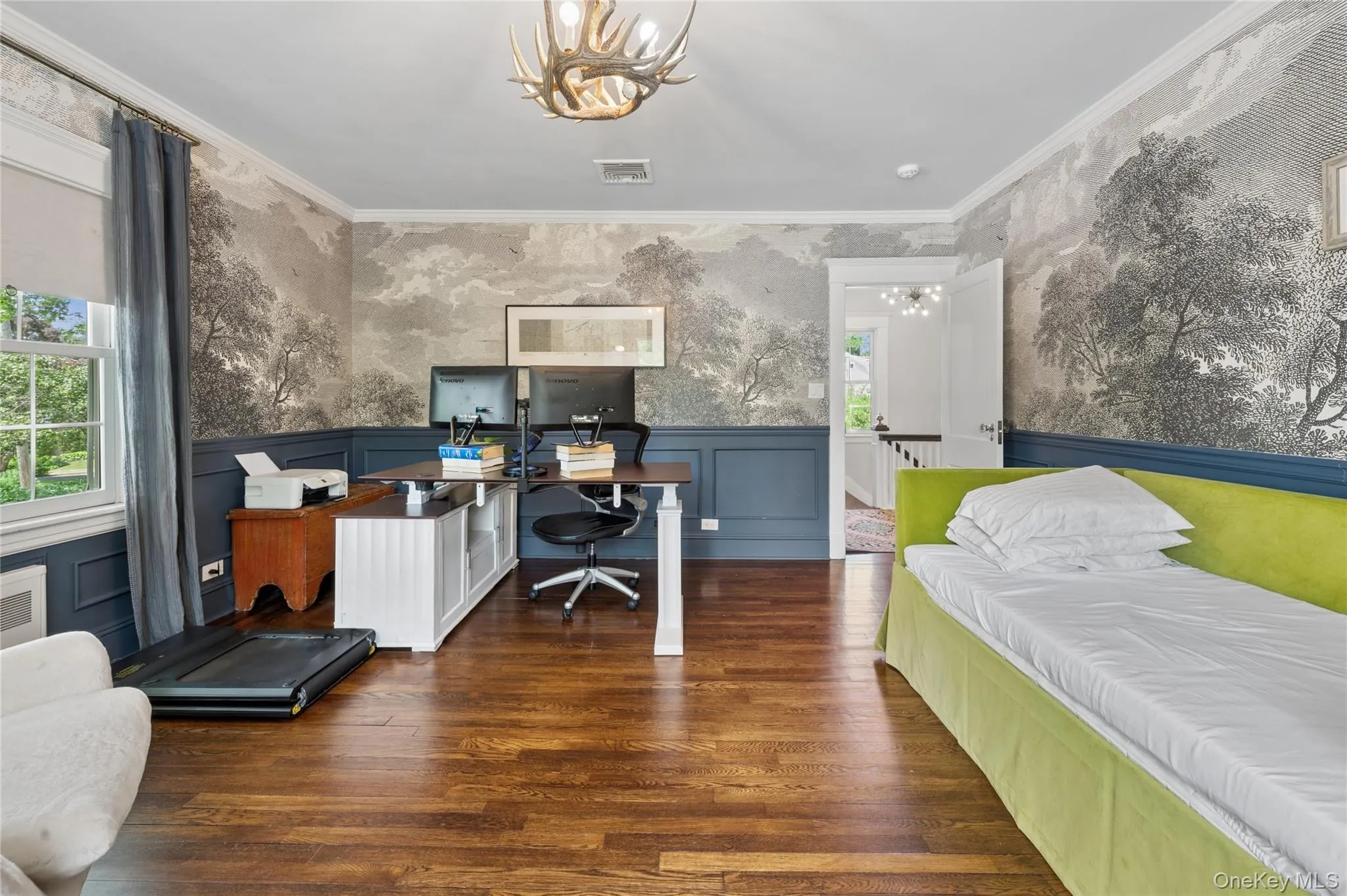 A second bedroom with wainscoting adds visual interest and is currently being used as an office. A second bedroom with wainscoting adds visual interest and is currently being used as an office.