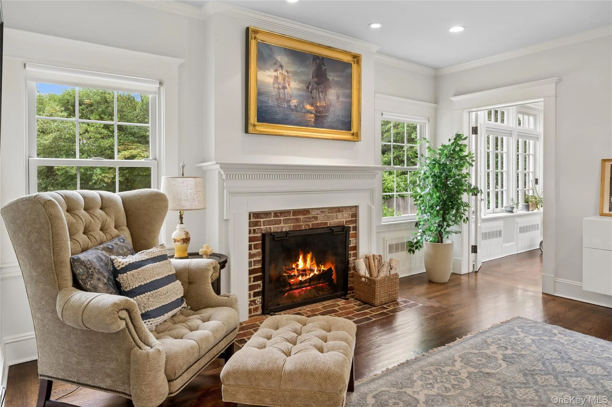 A wood burning fireplace accents the living room. A wood burning fireplace accents the living room.