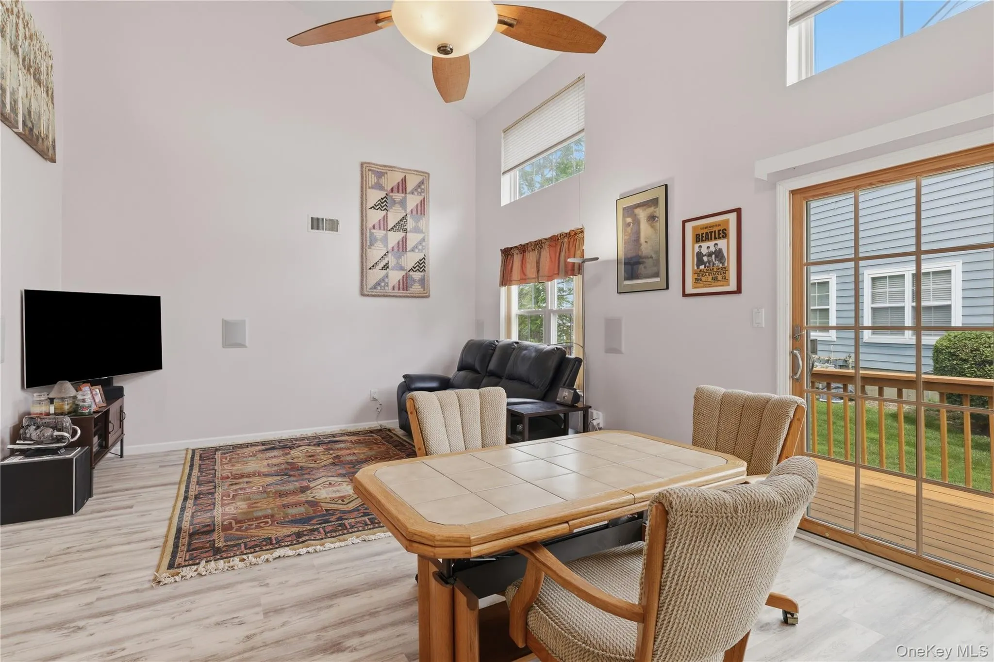 Vaulted ceilings featuring a ceiling fan with integrated lighting Vaulted ceilings featuring a ceiling fan with integrated lighting