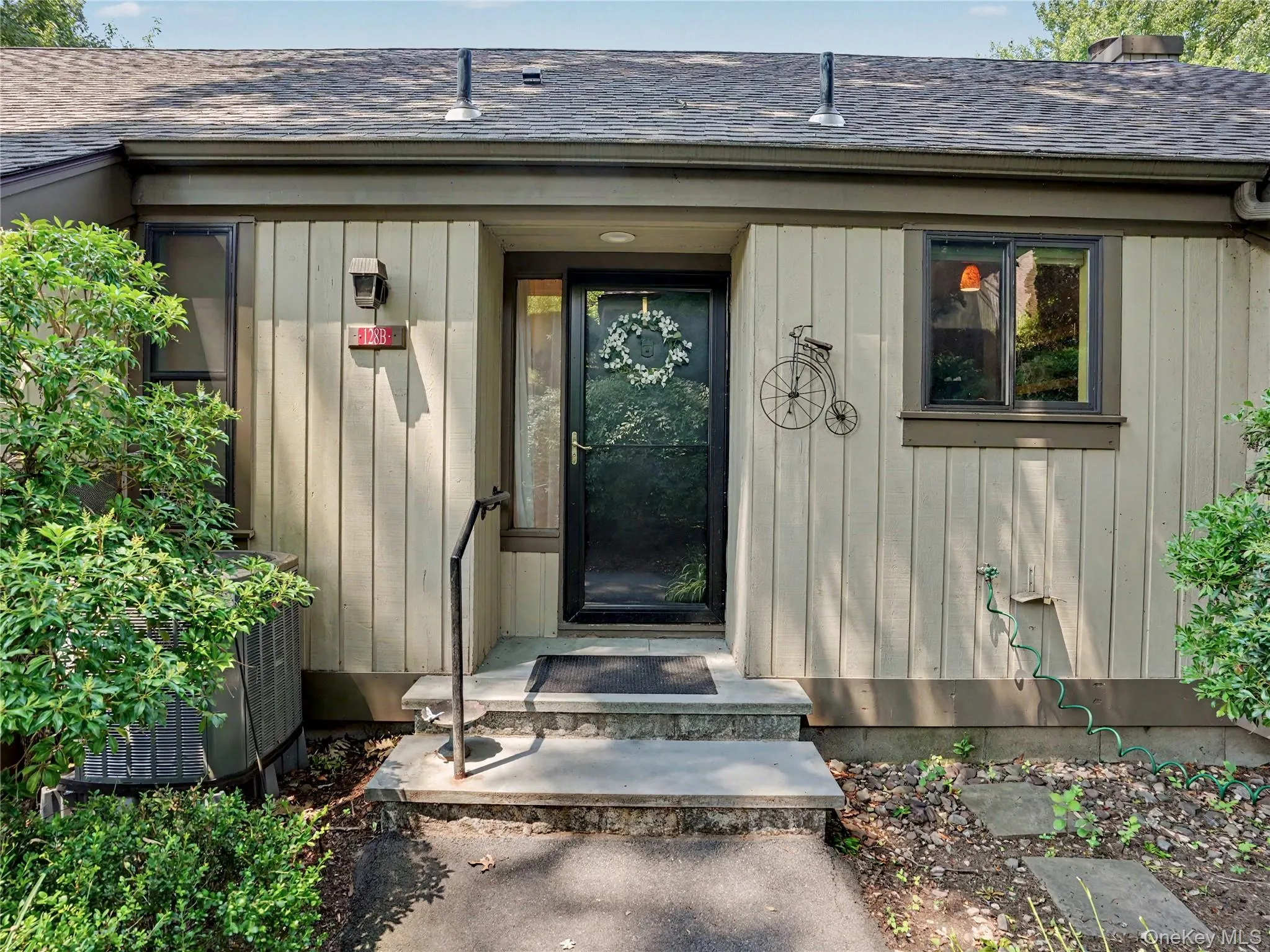 Attractive entrance with custom bluestone front steps that were extended forward and made deeper for easier access into the unit. Attractive entrance with custom bluestone front steps that were extended forward and made deeper for easier access into the unit.