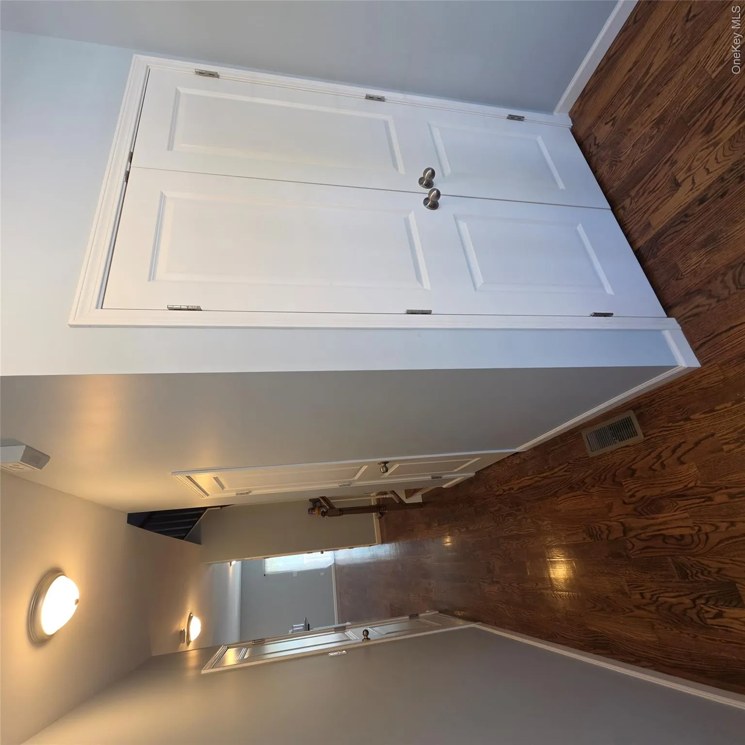 Garage Door on left, Half-bath Door, Entryway Coat Closet on far right. Garage Door on left, Half-bath Door, Entryway Coat Closet on far right.