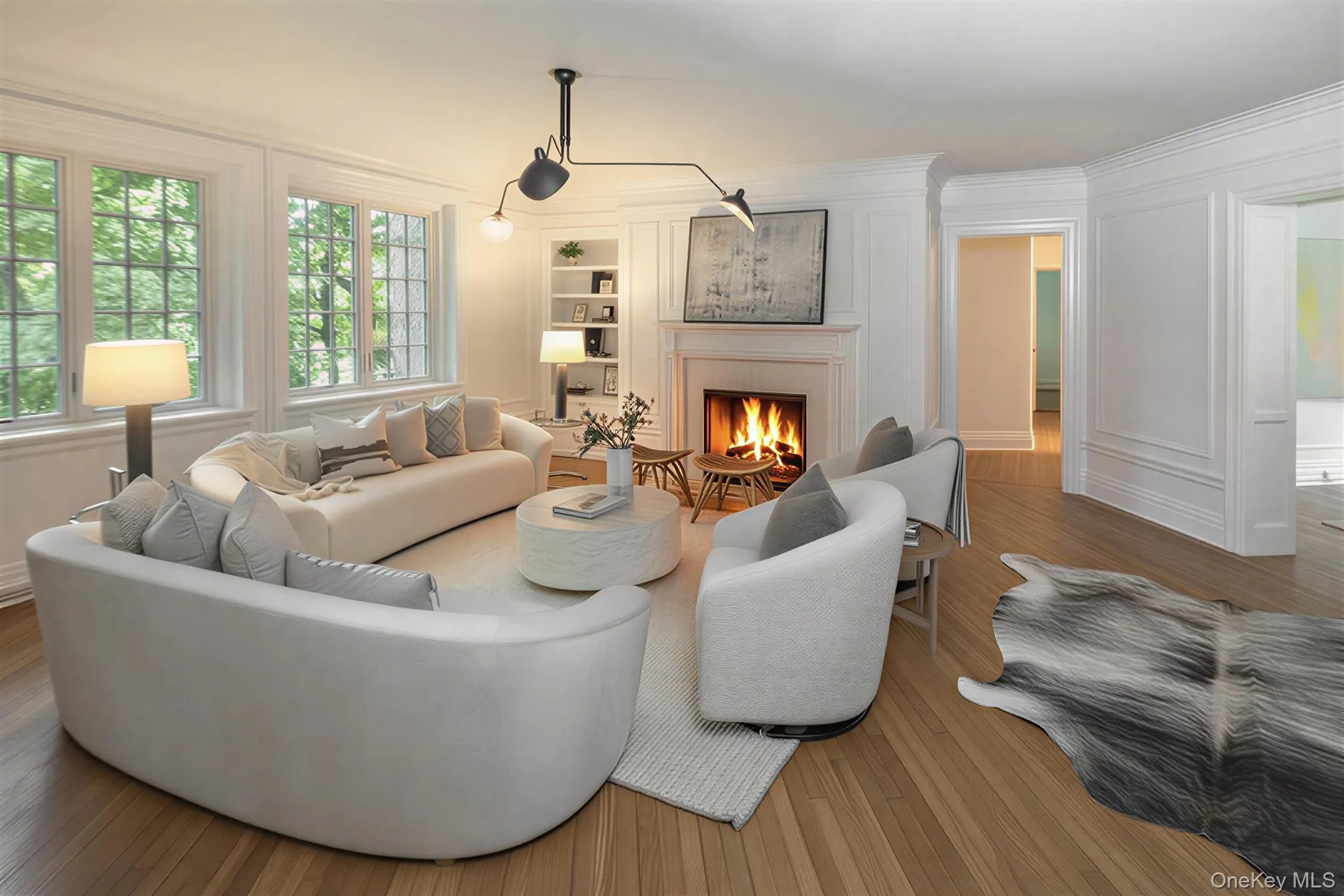Spacious Living room with fireplace offers lovely views of the Bronxville Lake through new divided light windows Spacious Living room with fireplace offers lovely views of the Bronxville Lake through new divided light windows