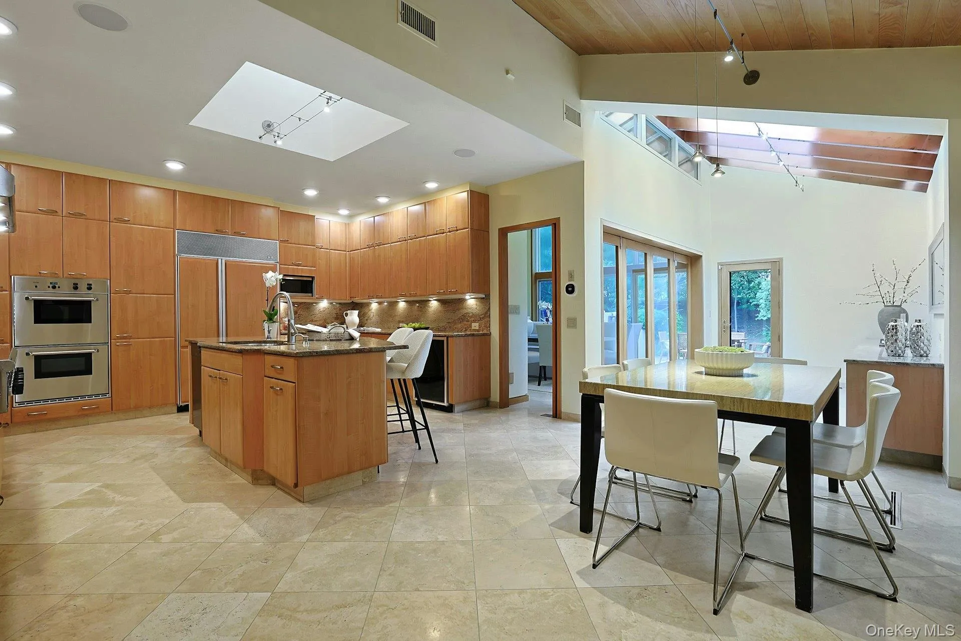 The spacious dining area creates a comfortable setting for casual meals with easy access to the surrounding patios. The spacious dining area creates a comfortable setting for casual meals with easy access to the surrounding patios.