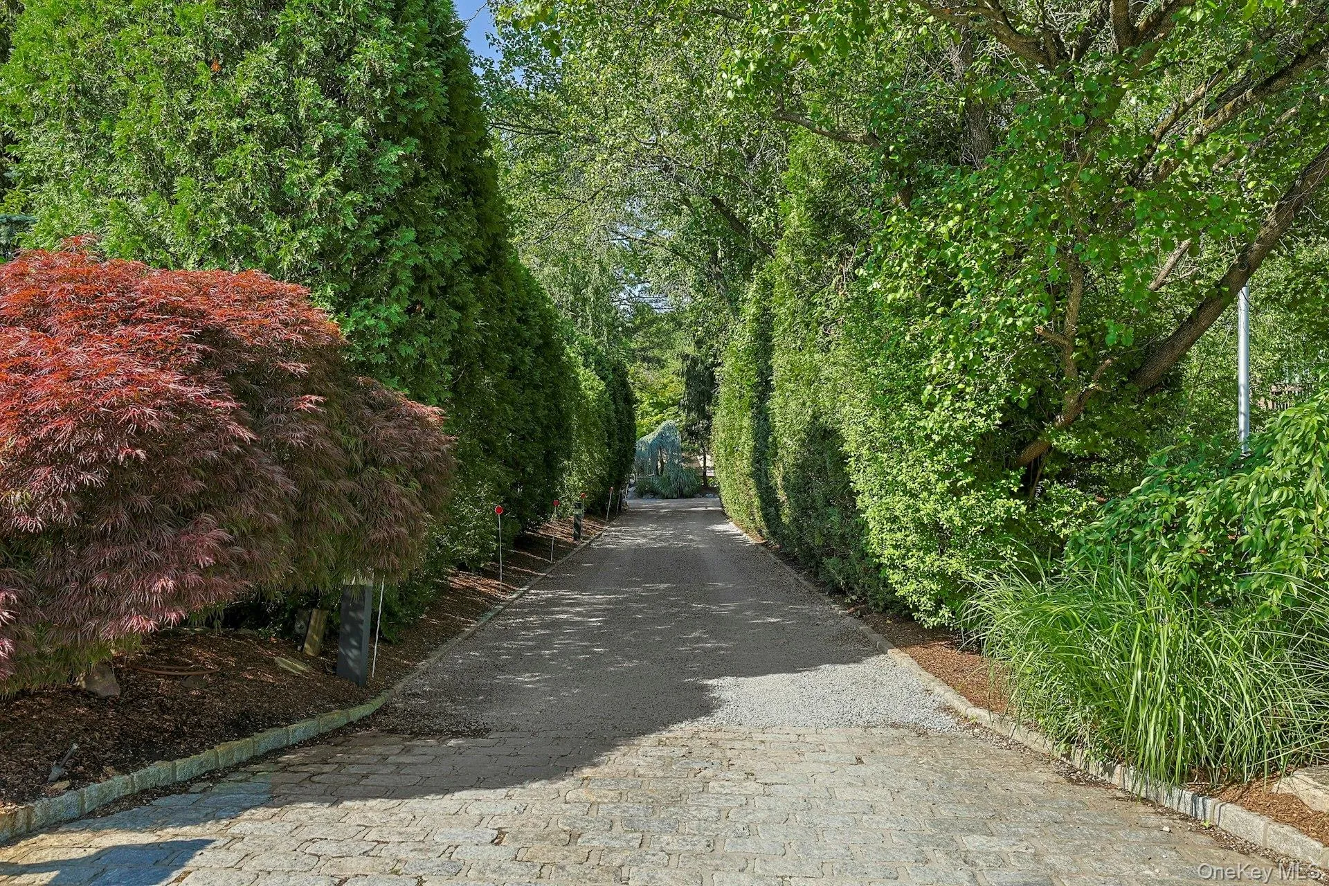 Follow the winding private drive through towering evergreens and discover a spectacular retreat completely secluded from the road. Follow the winding private drive through towering evergreens and discover a spectacular retreat completely secluded from the road.