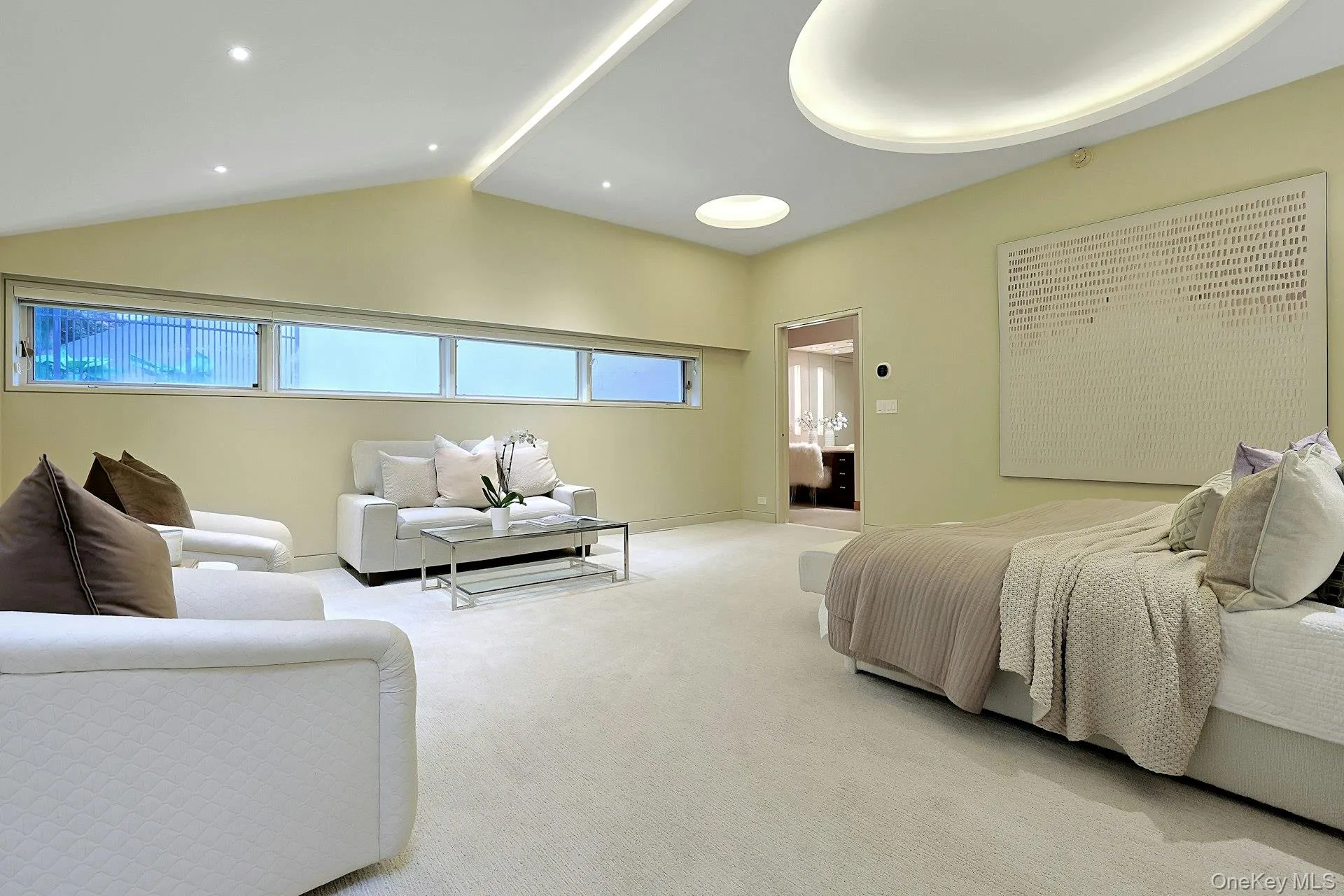 Designed as a private retreat, the primary bedroom combines generous proportions with a tranquil, light-filled setting. Designed as a private retreat, the primary bedroom combines generous proportions with a tranquil, light-filled setting.