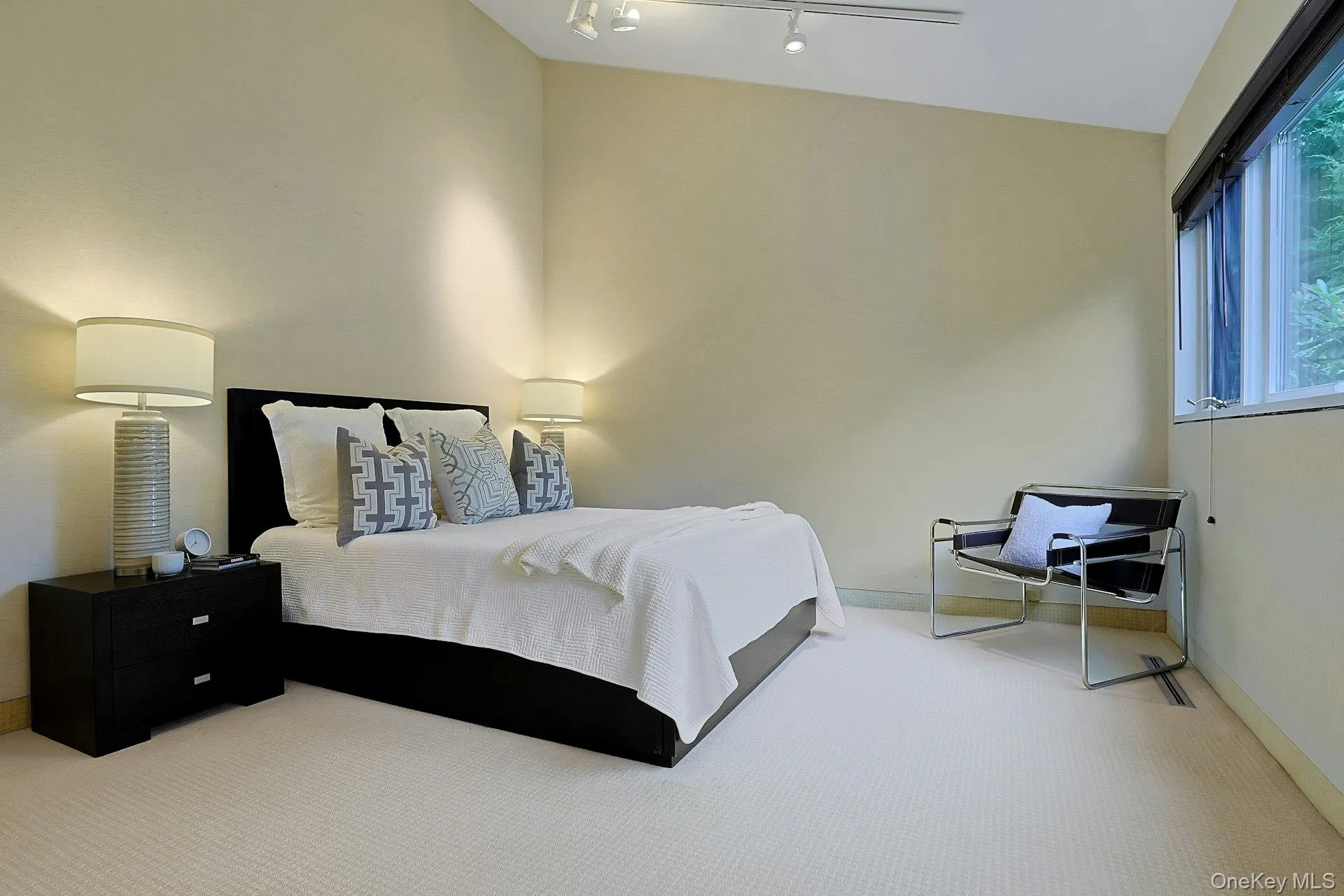 . Bright and inviting, this secondary bedroom provides comfortable accommodations for children or guests. These two bedrooms share a large hall bath with tub and shower. . Bright and inviting, this secondary bedroom provides comfortable accommodations for children or guests. These two bedrooms share a large hall bath with tub and shower.