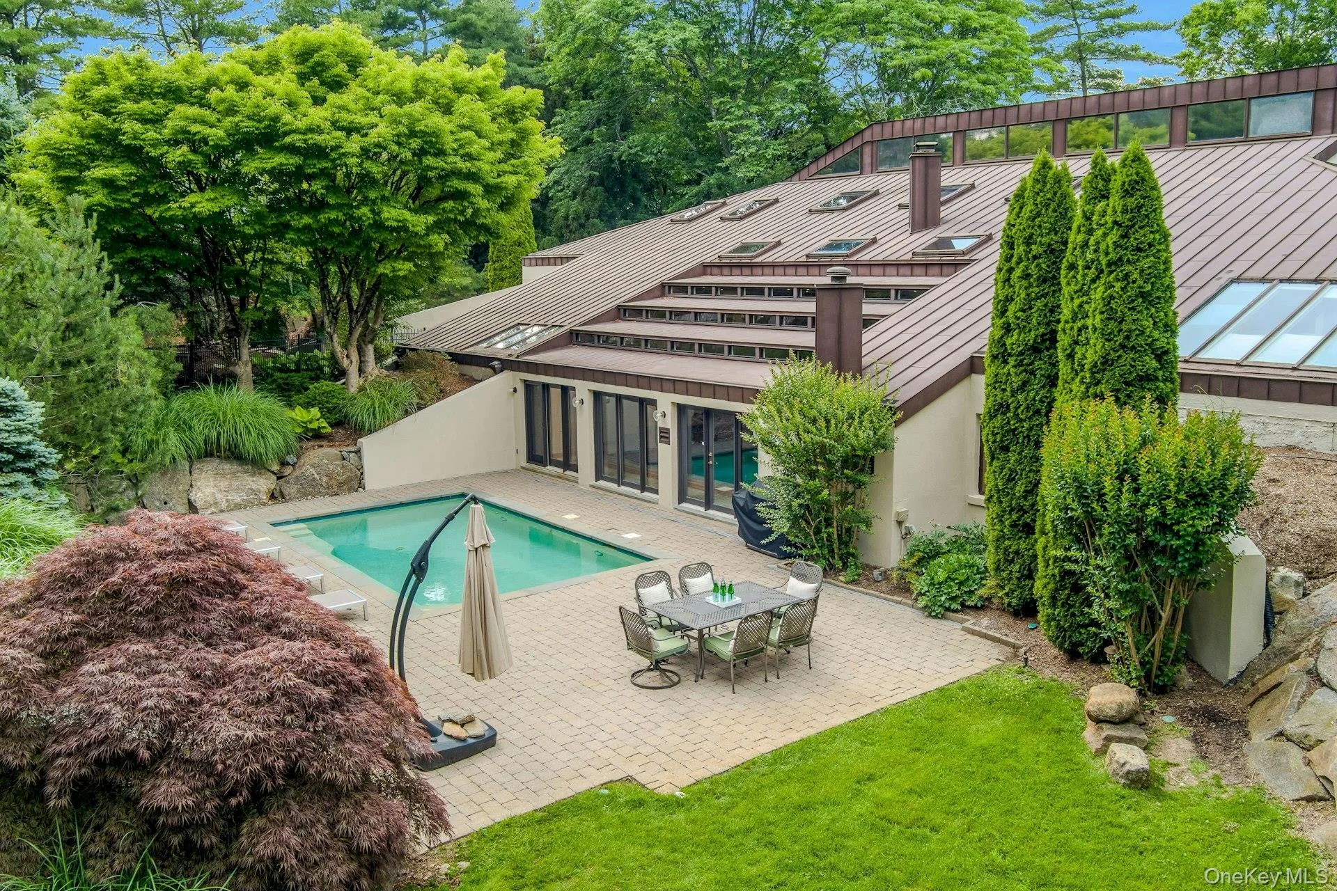 Resort-style outdoor living includes a stunning private pool, creating an idyllic setting for relaxation and entertaining. Resort-style outdoor living includes a stunning private pool, creating an idyllic setting for relaxation and entertaining.