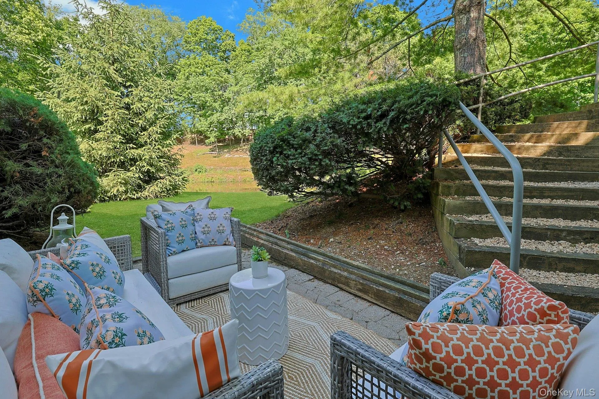 Tucked beneath a canopy of mature trees, this secluded patio off of the playroom creates a peaceful extension of the lower level and a quiet place to relax. Tucked beneath a canopy of mature trees, this secluded patio off of the playroom creates a peaceful extension of the lower level and a quiet place to relax.