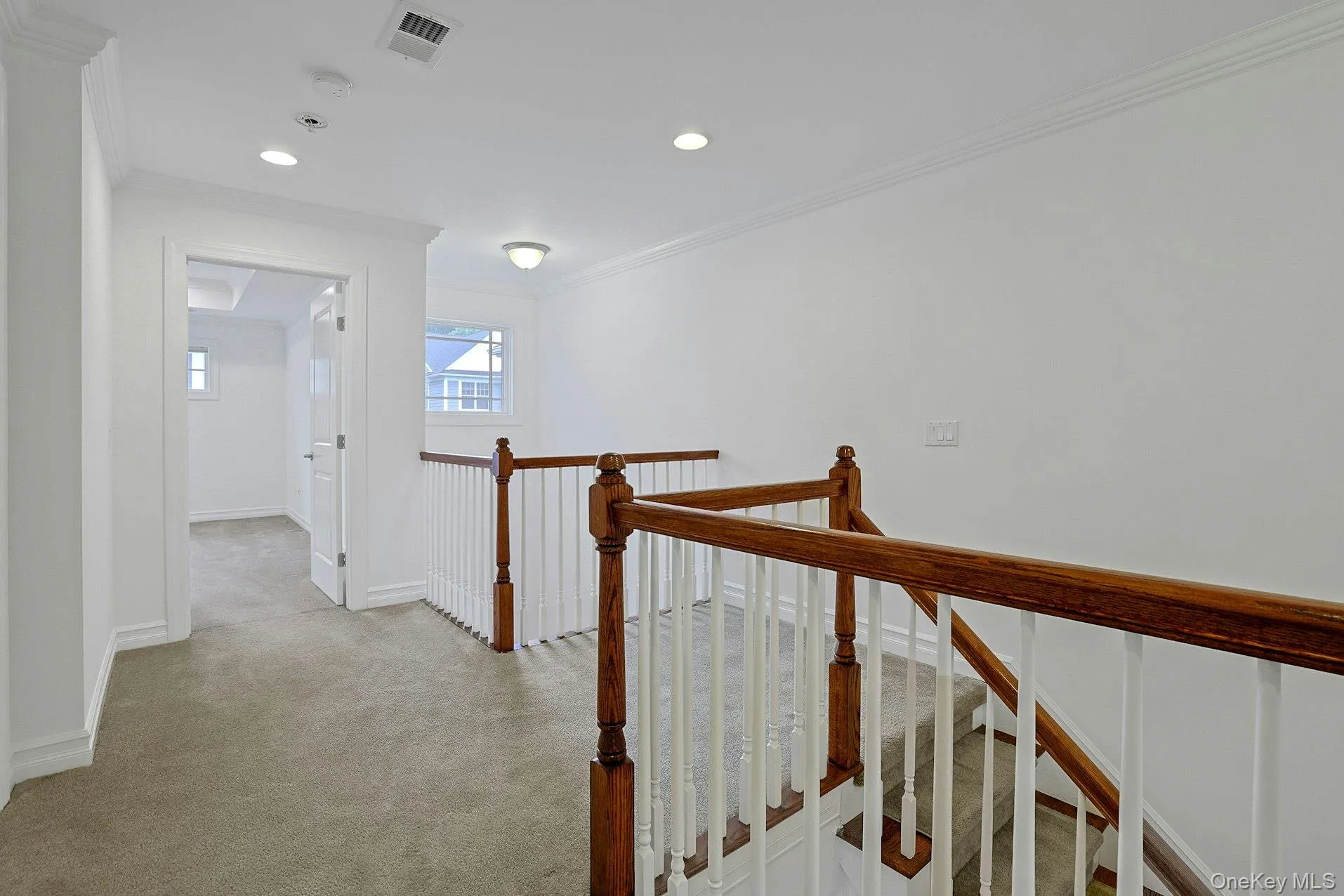 A spacious second-floor landing connects the bedroom level and creates an airy sense of openness, while providing convenient access to the elevator and all three bedrooms. The carpeted hallway enhances comfort and quiet throughout this private level of the home. A spacious second-floor landing connects the bedroom level and creates an airy sense of openness, while providing convenient access to the elevator and all three bedrooms. The carpeted hallway enhances comfort and quiet throughout this private level of the home.