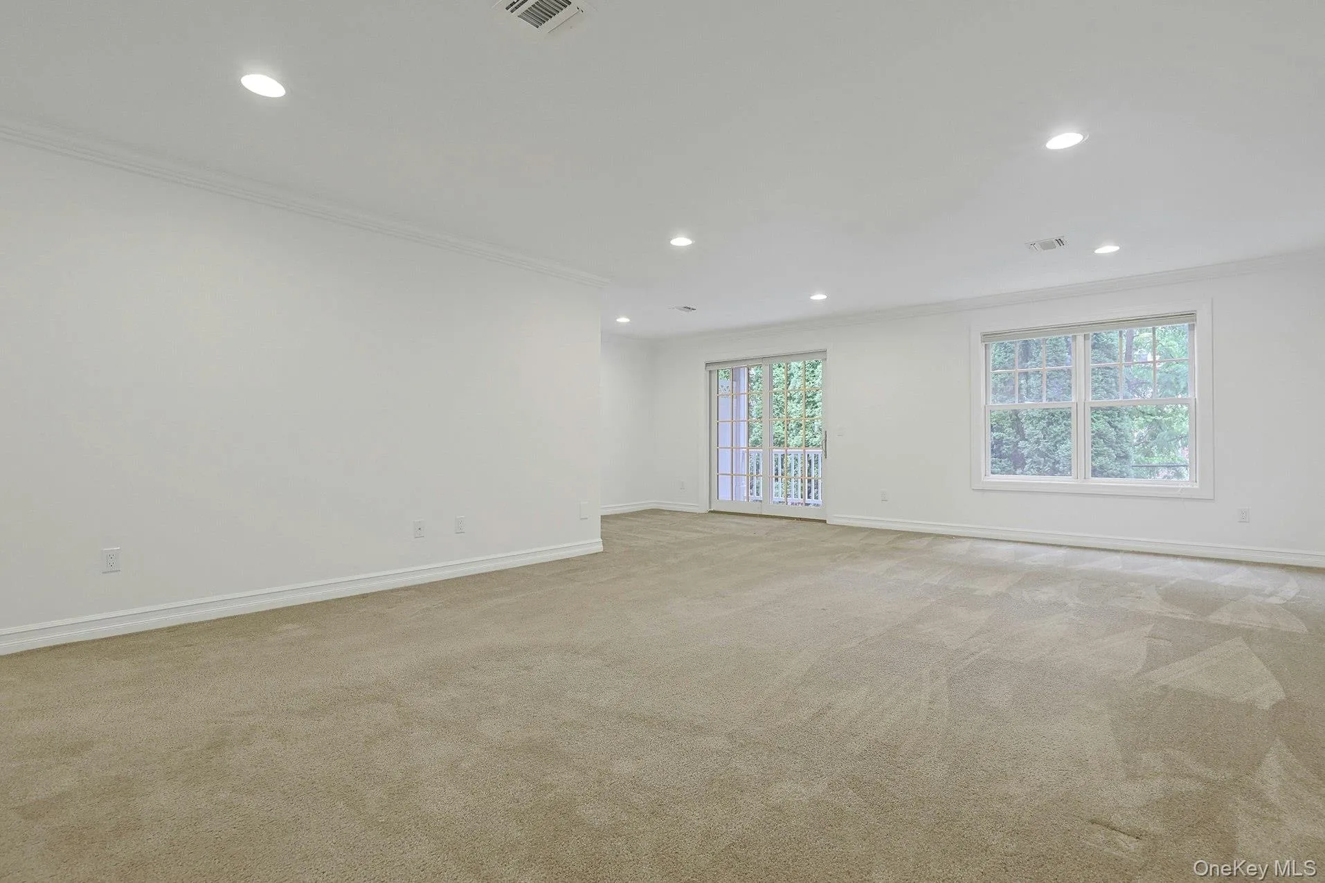 An expansive recreation room provides endless possibilities for a media room, playroom, fitness space, or home office, with ample room for multiple seating and activity areas. An expansive recreation room provides endless possibilities for a media room, playroom, fitness space, or home office, with ample room for multiple seating and activity areas.