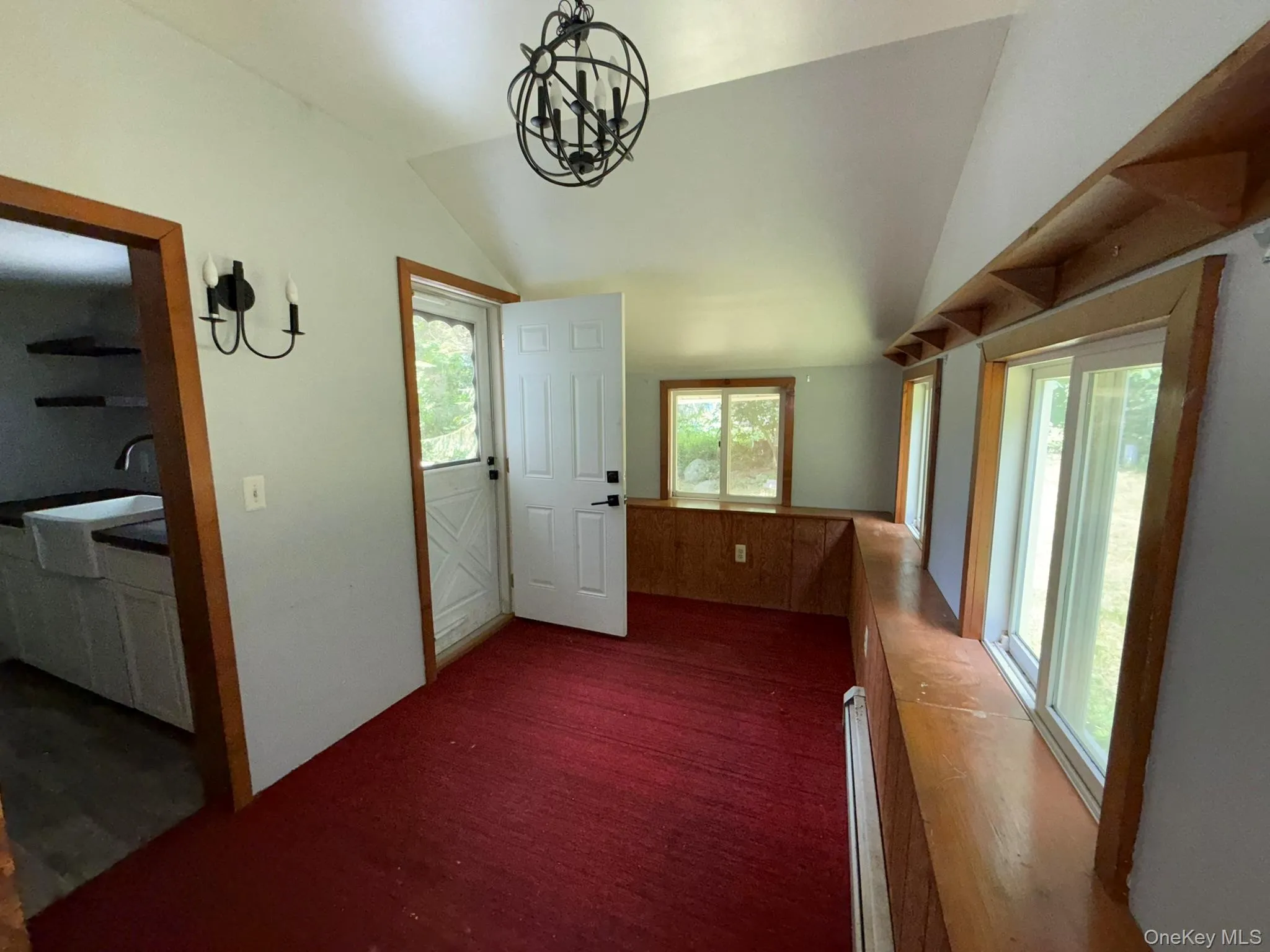 Door in the left-hand corner leads to the outdoor deck Door in the left-hand corner leads to the outdoor deck