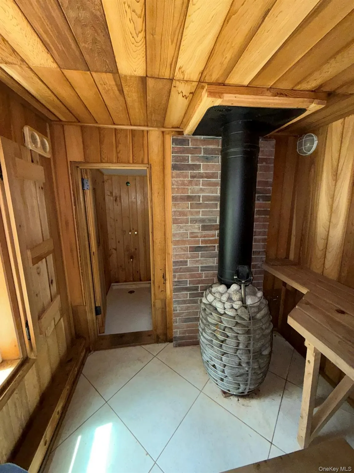 Sauna with shower seen on the left Sauna with shower seen on the left